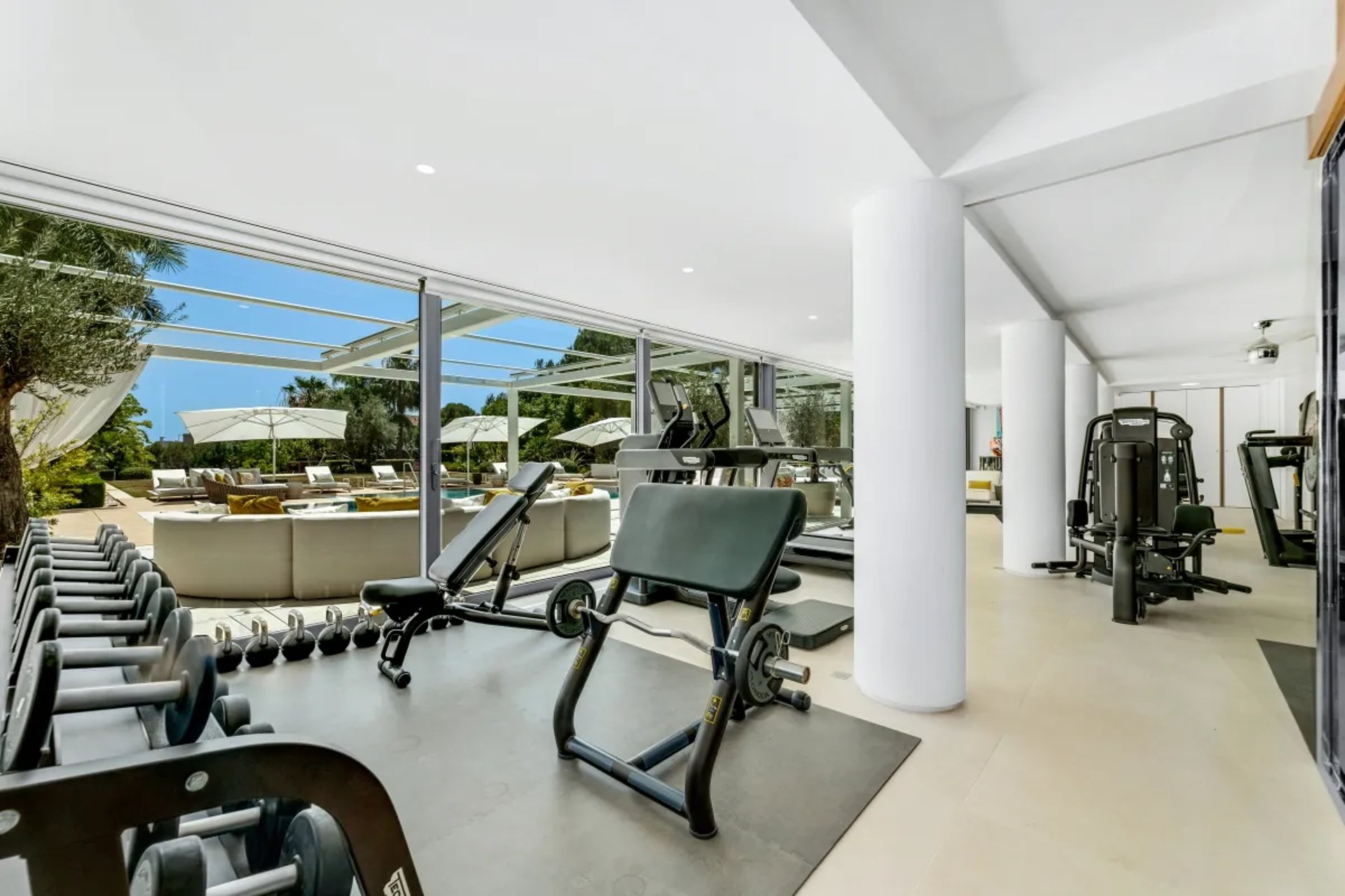 Villa Serenity private gym with cardio machines and sea view