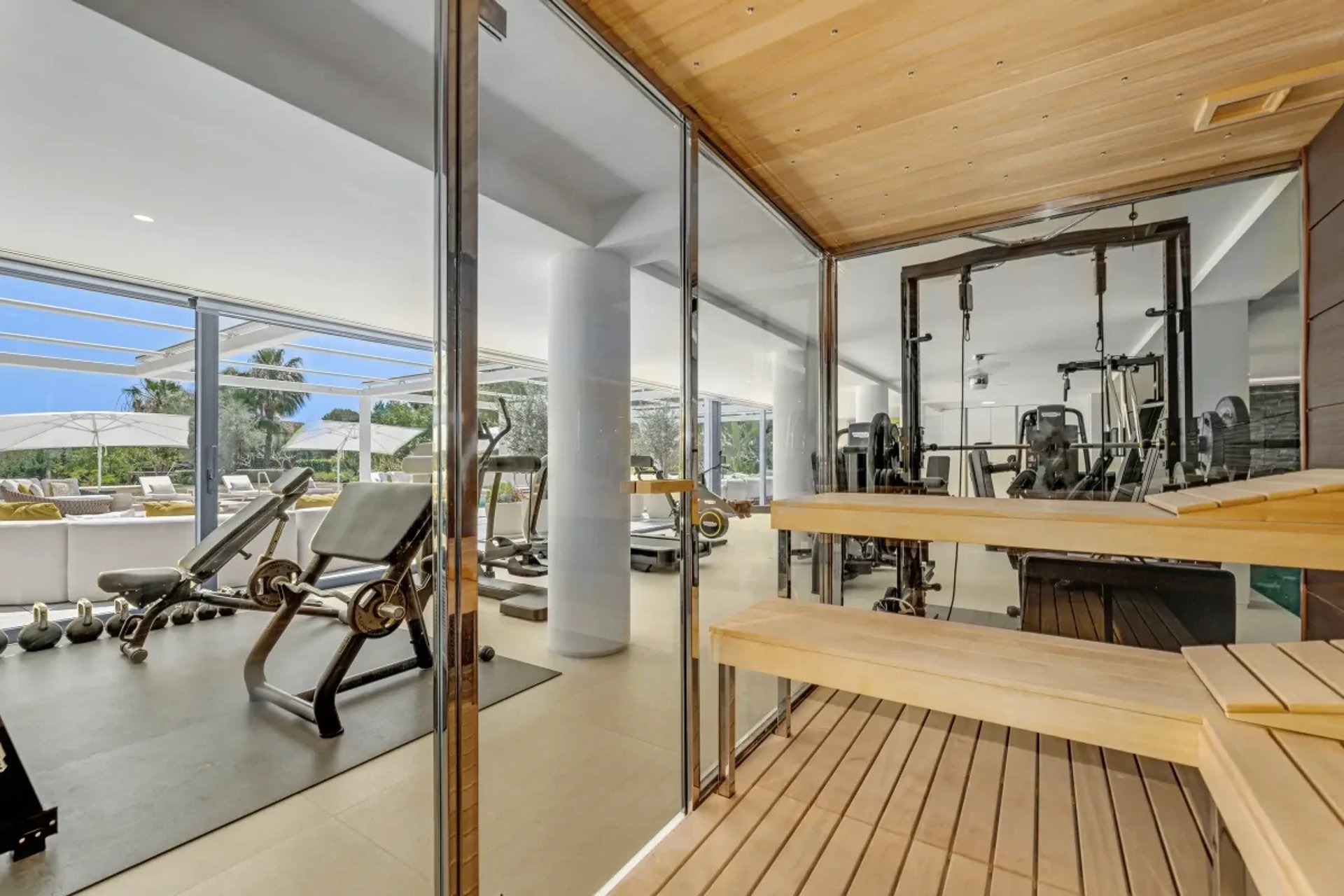 Spa area with loungers and wood ceiling at Villa Serenity