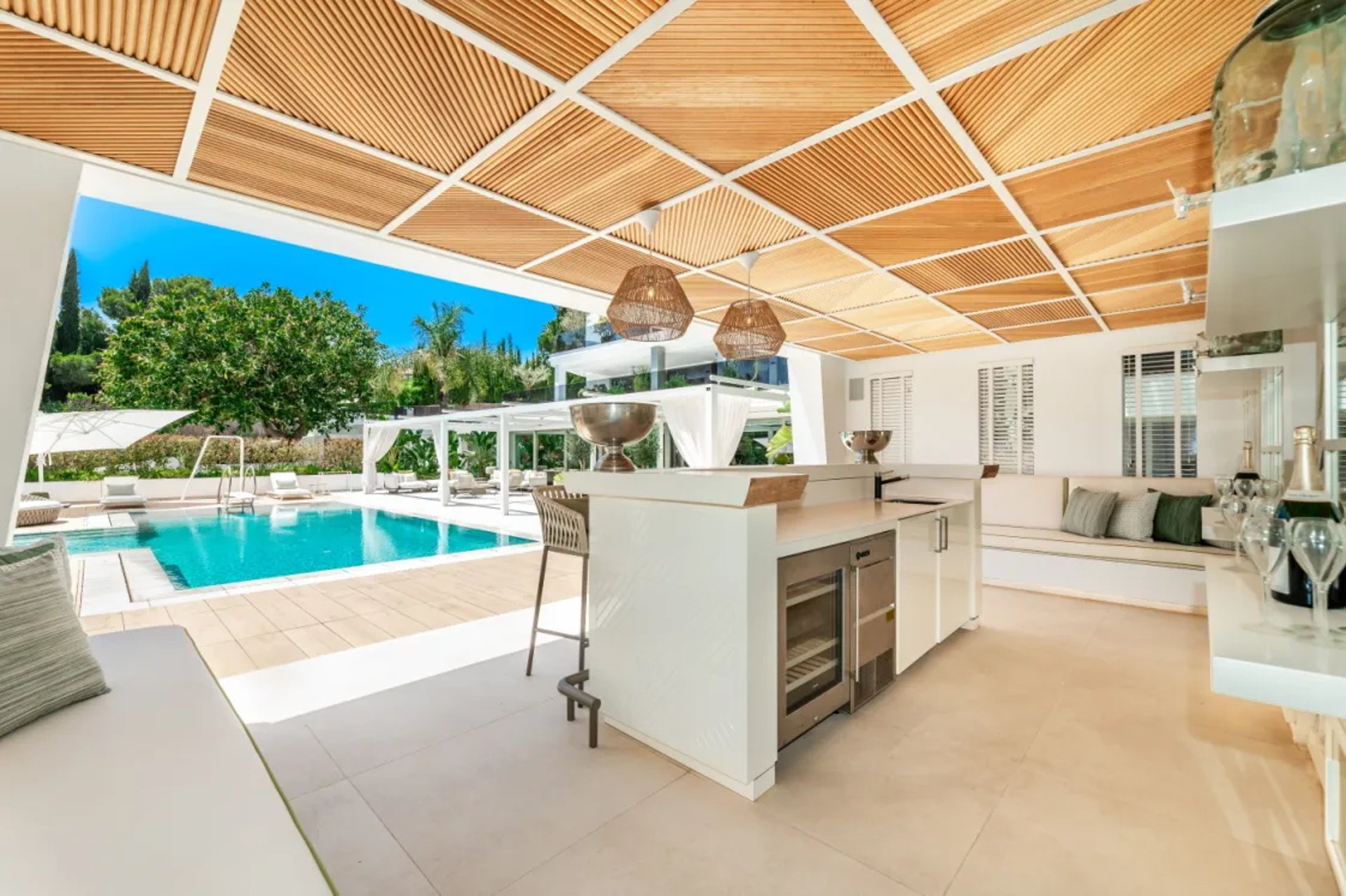 Villa Serenity pool bar with modern white canopy roof