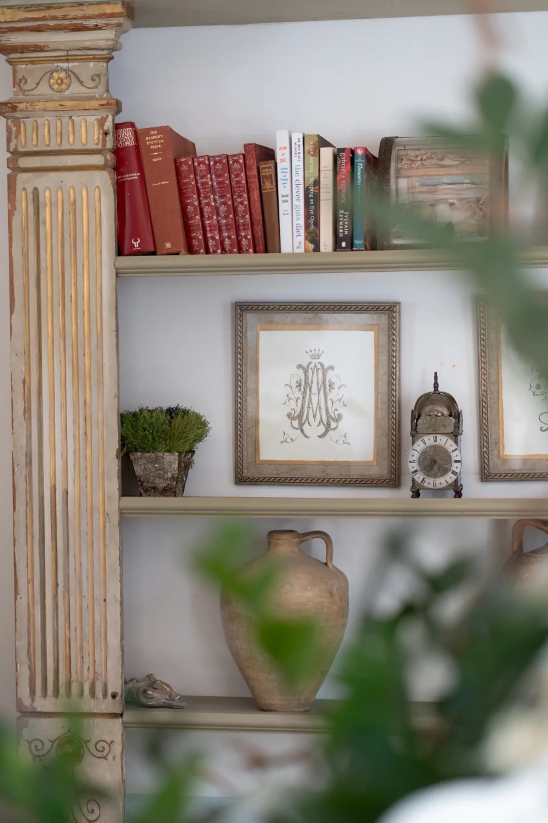 Decorated bookshelf with antiques at Finca Santa Katerina