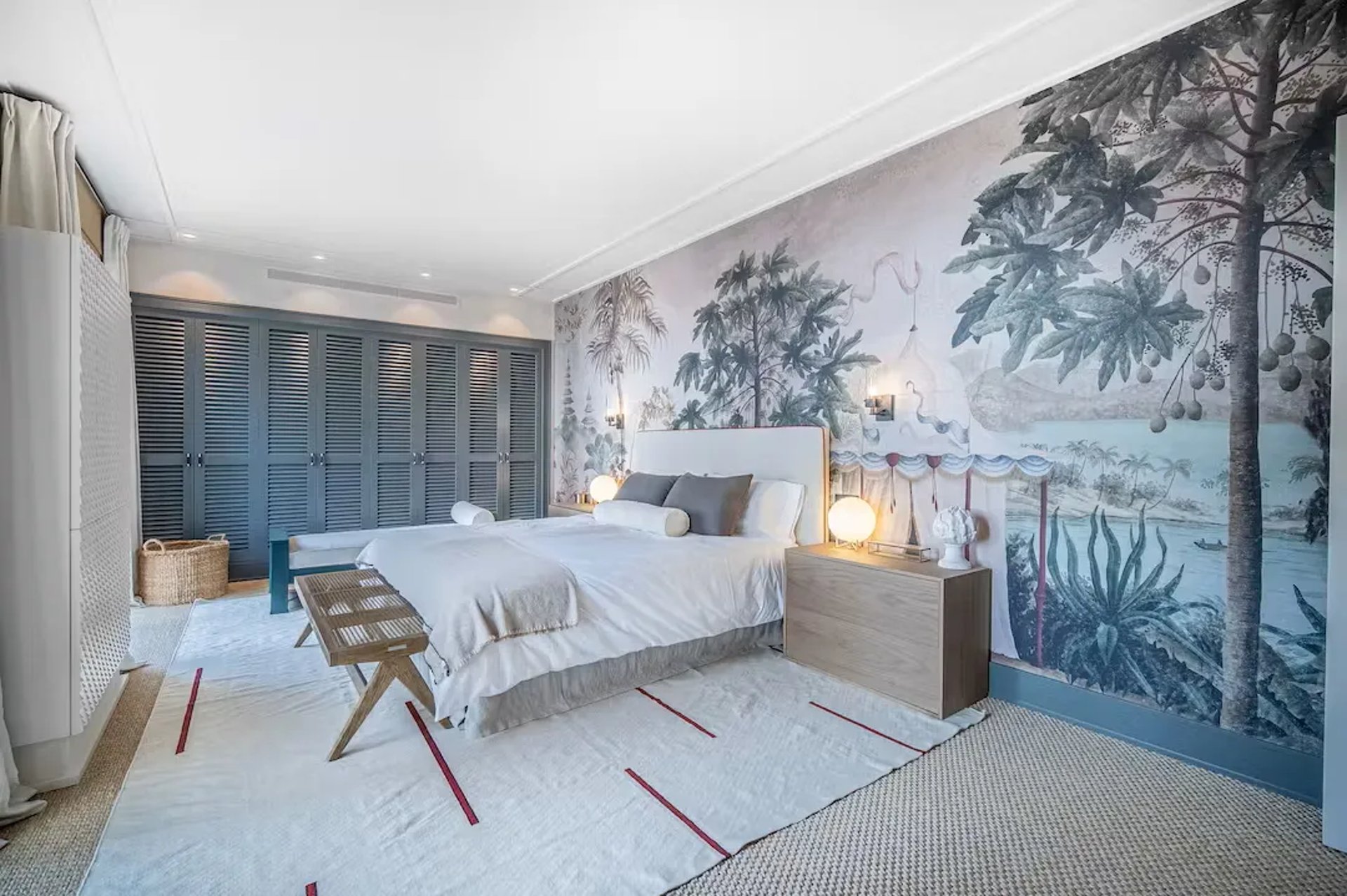 Bedroom at Villa La Gratitud with natural textures and warm lighting