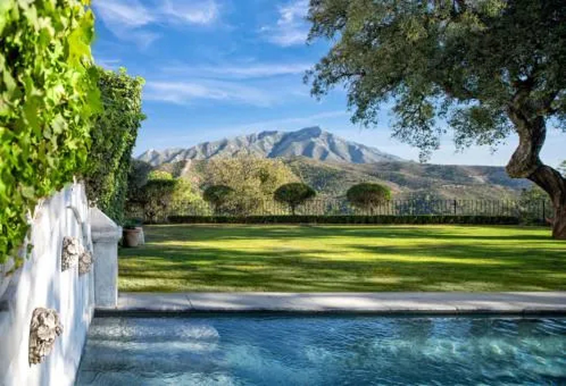 Swimming pool with mountain backdrop at Finca Santa Katerina