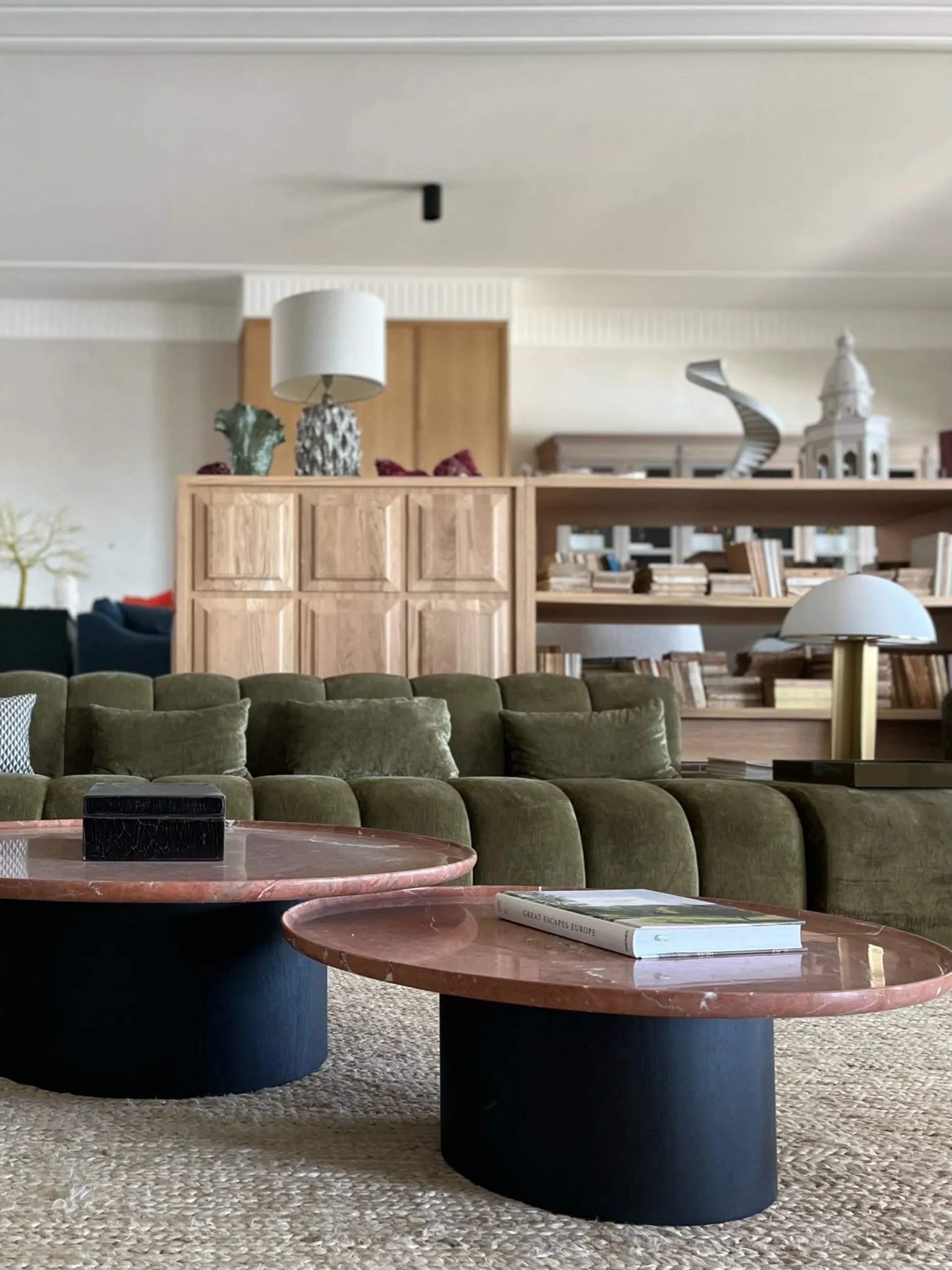 Lounge at Villa La Gratitud with curved sofas and contemporary finishes