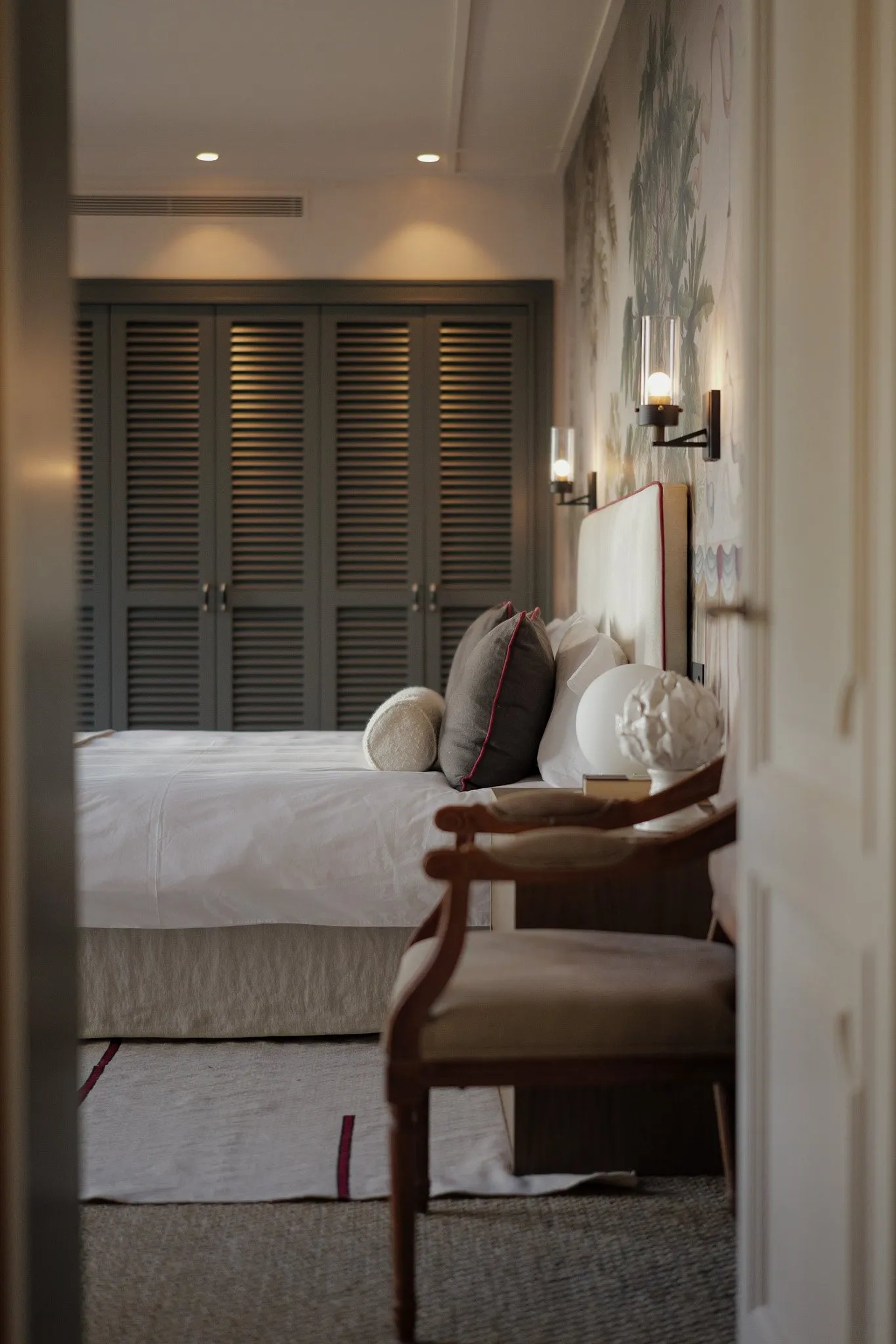 Bedroom at Villa La Gratitud with natural textures and warm lighting