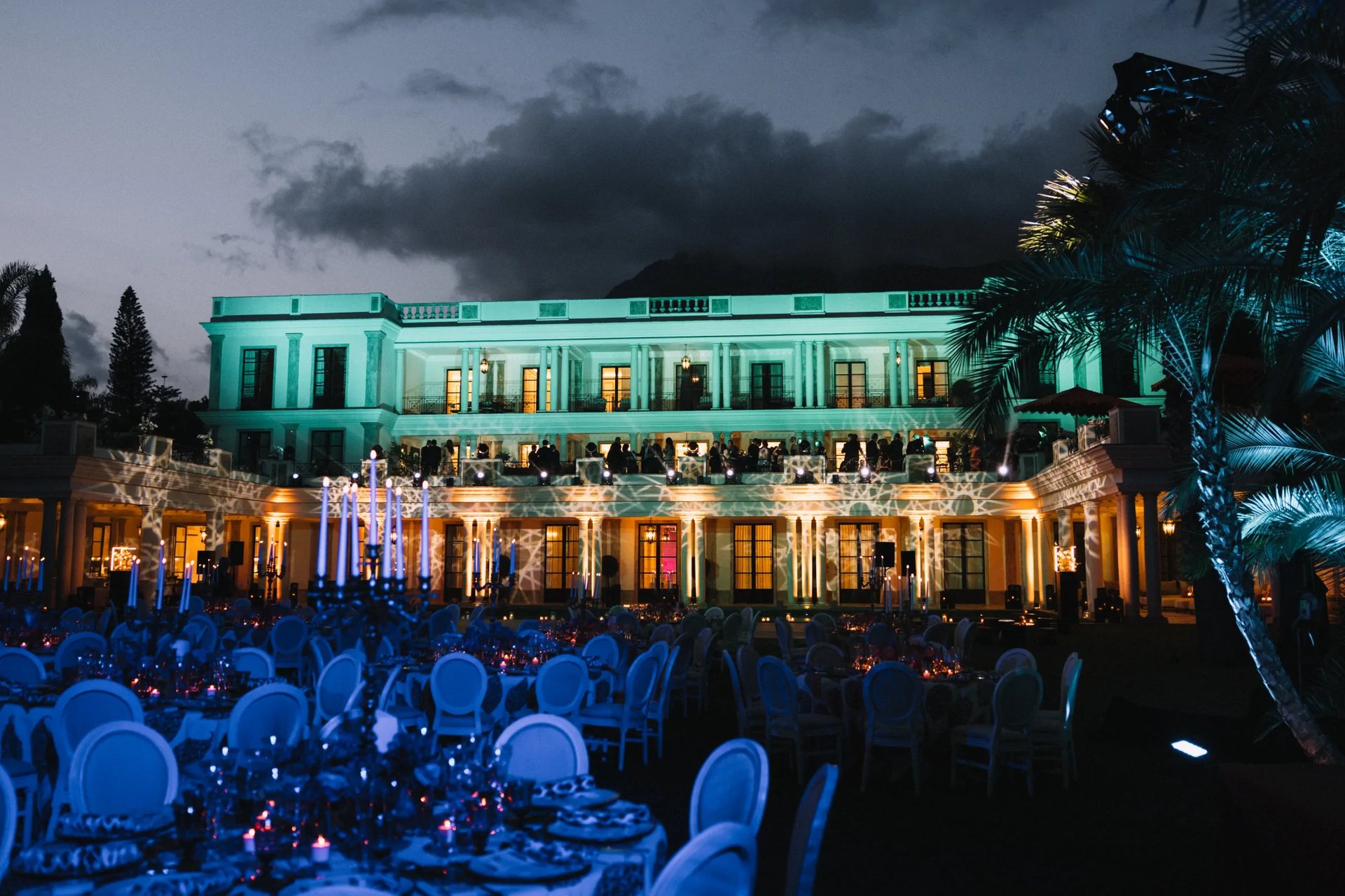 Evening gala event in illuminated villa gardens