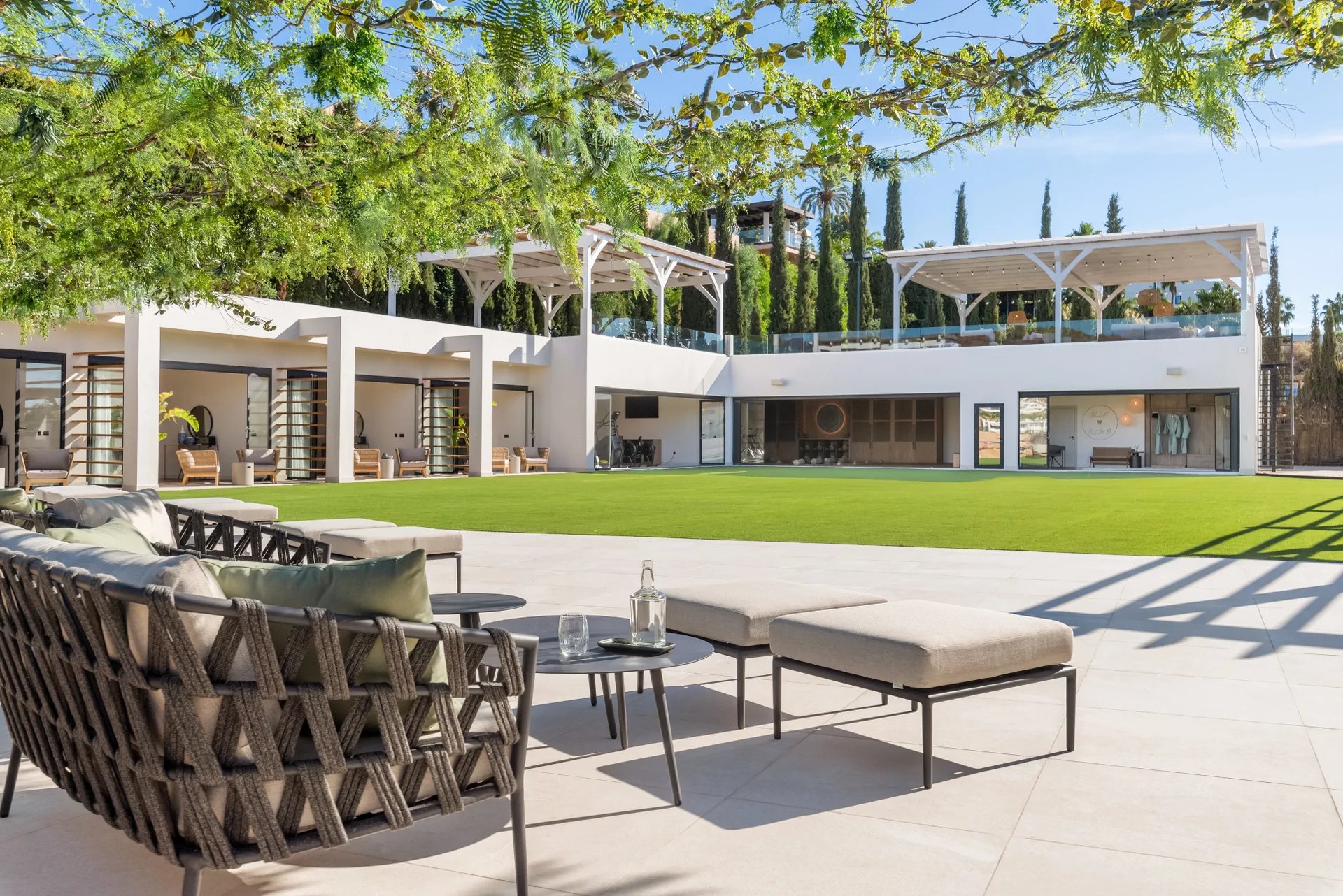 Private courtyard with flat lawn and open wellness spaces