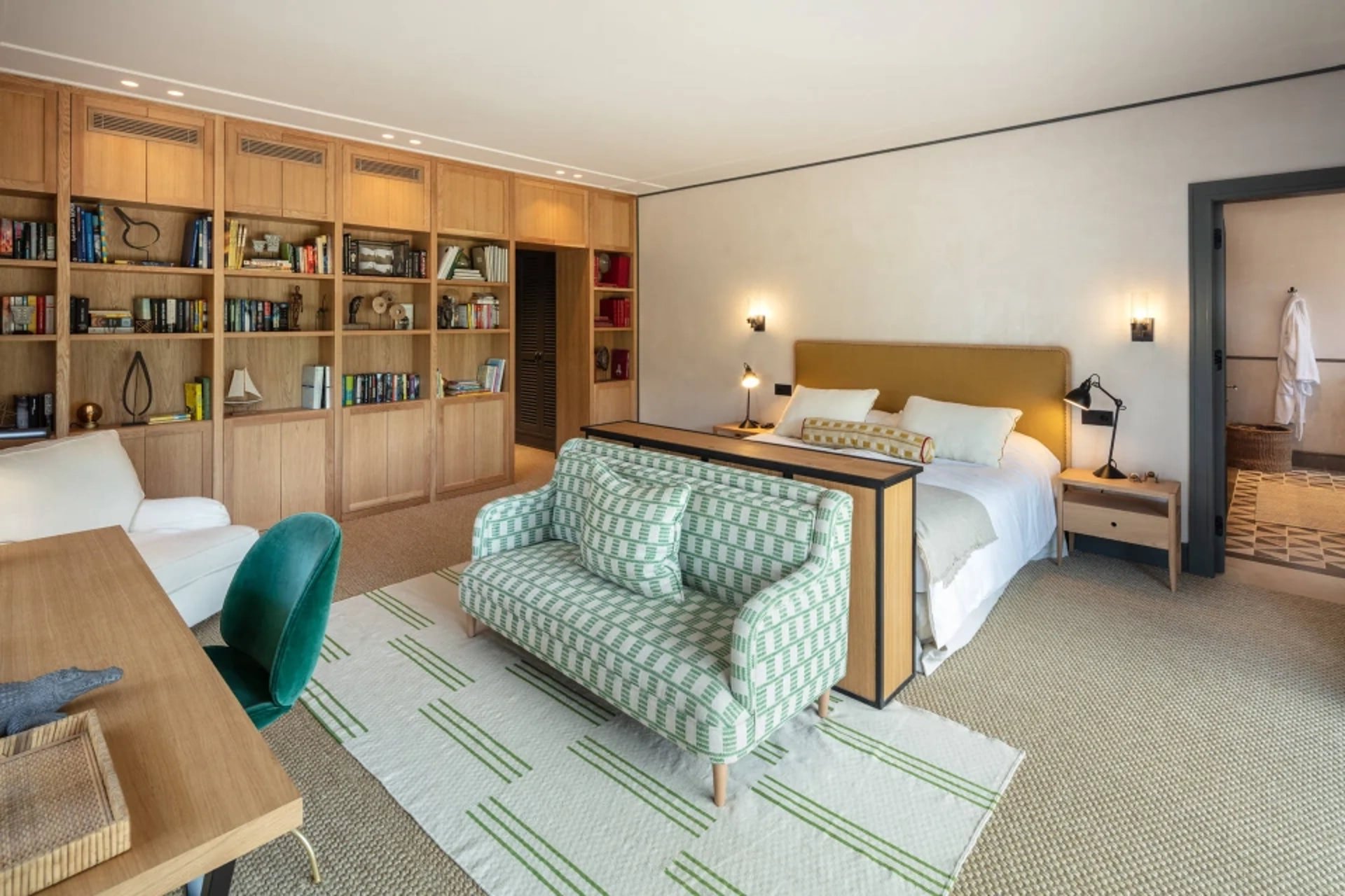 Bedroom at Villa La Gratitud with custom oak library wall