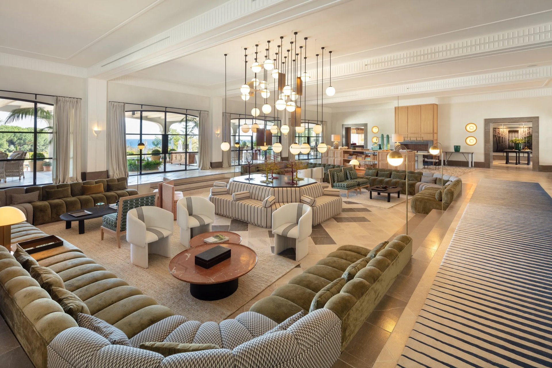 Salon at Villa La Gratitud with chandeliers and custom furnishings