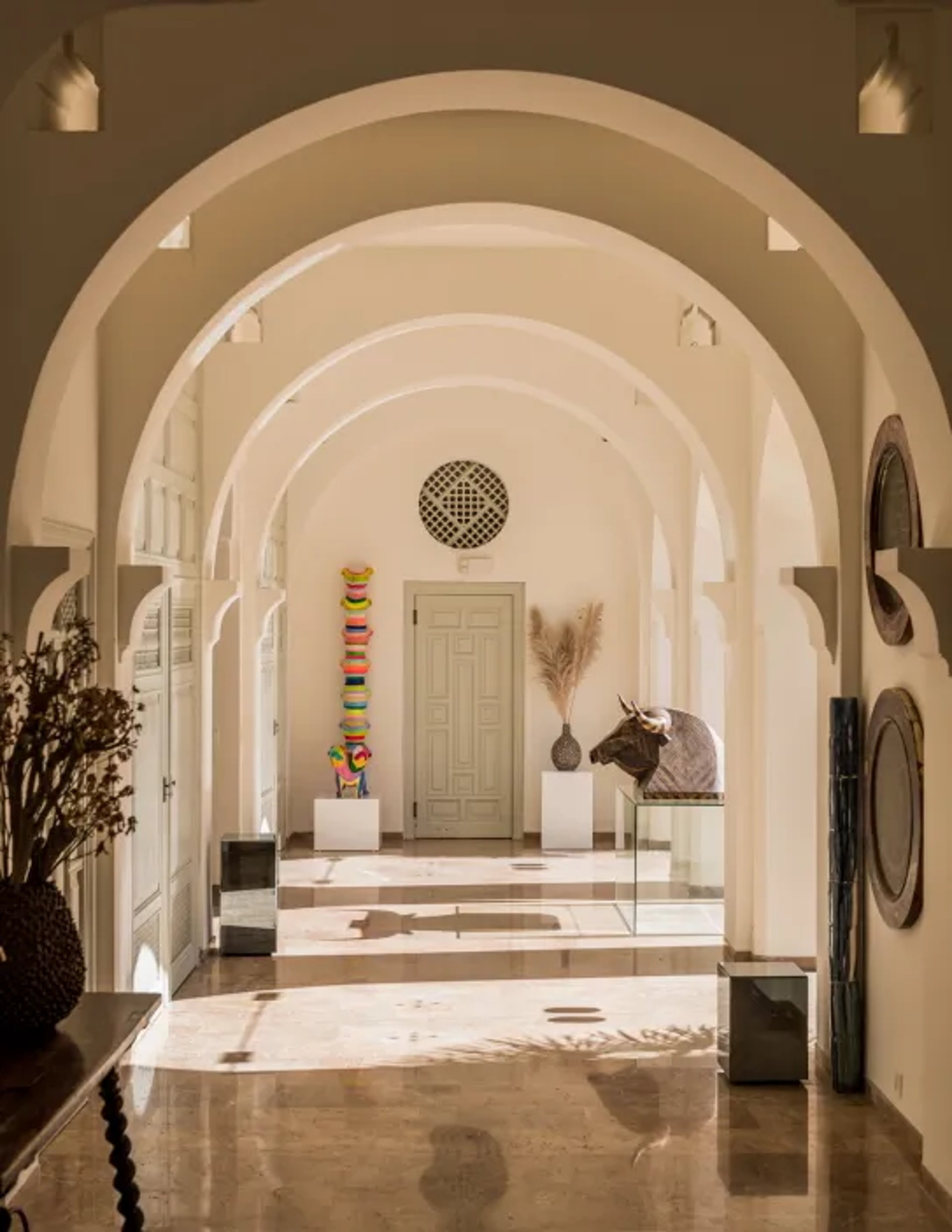 Arched hallway at Villa El Rincon with lanterns