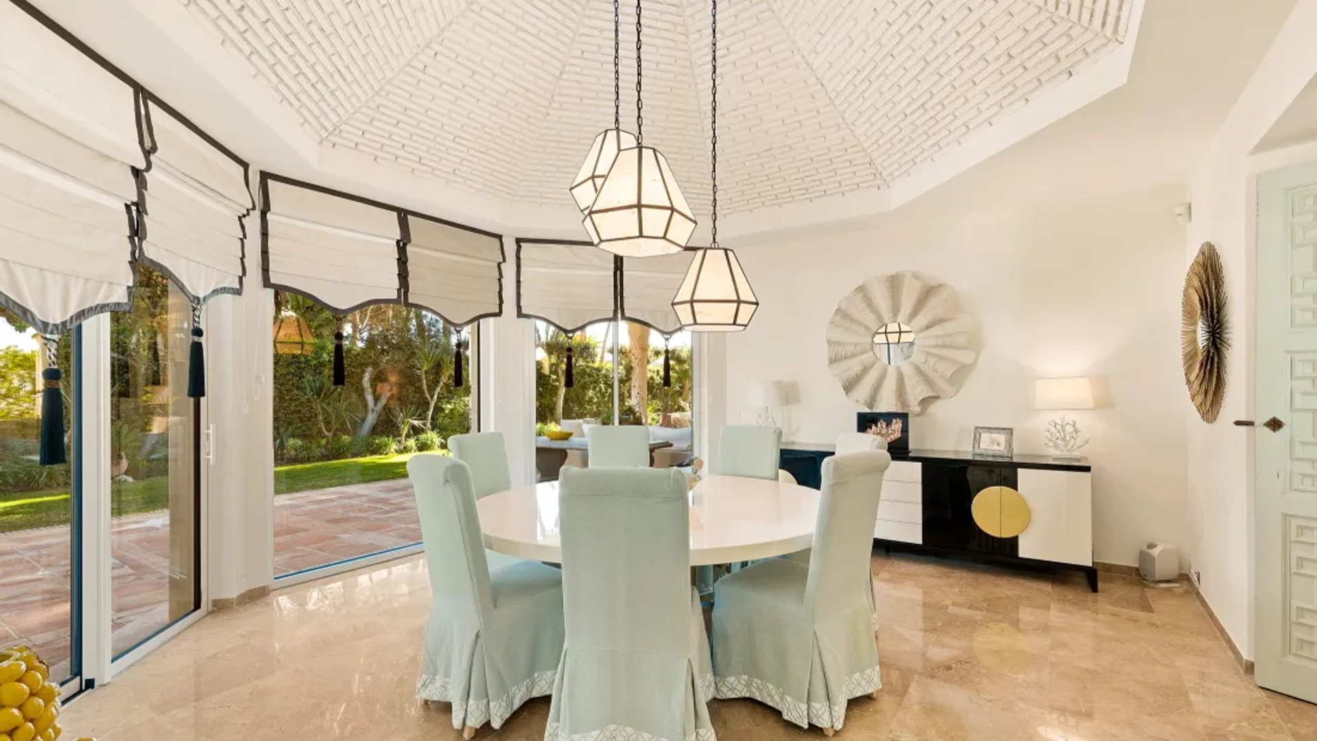 Dining space at Villa El Rincon with arched windows