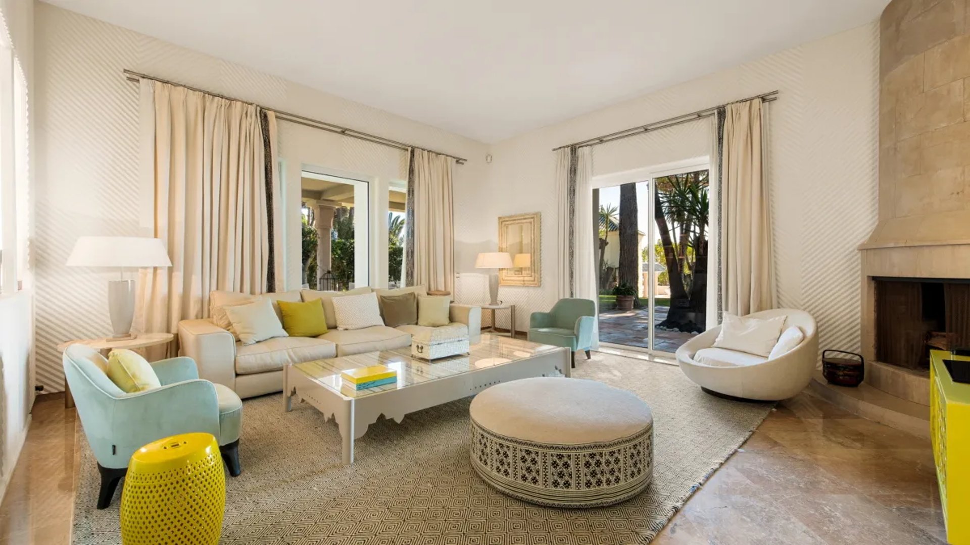Bright sitting room at Villa El Rincon with garden views