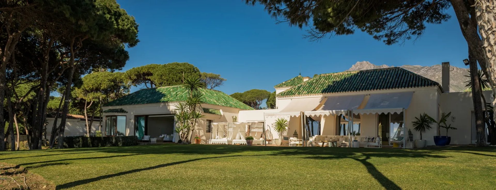 Exterior facade of Villa El Rincon surrounded by gardens