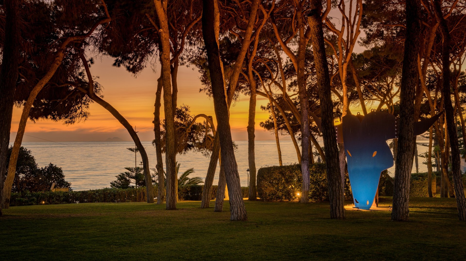 Main entrance of Villa El Rincon in Marbella, featuring a grand rotunda framed by two elegant olive trees.
