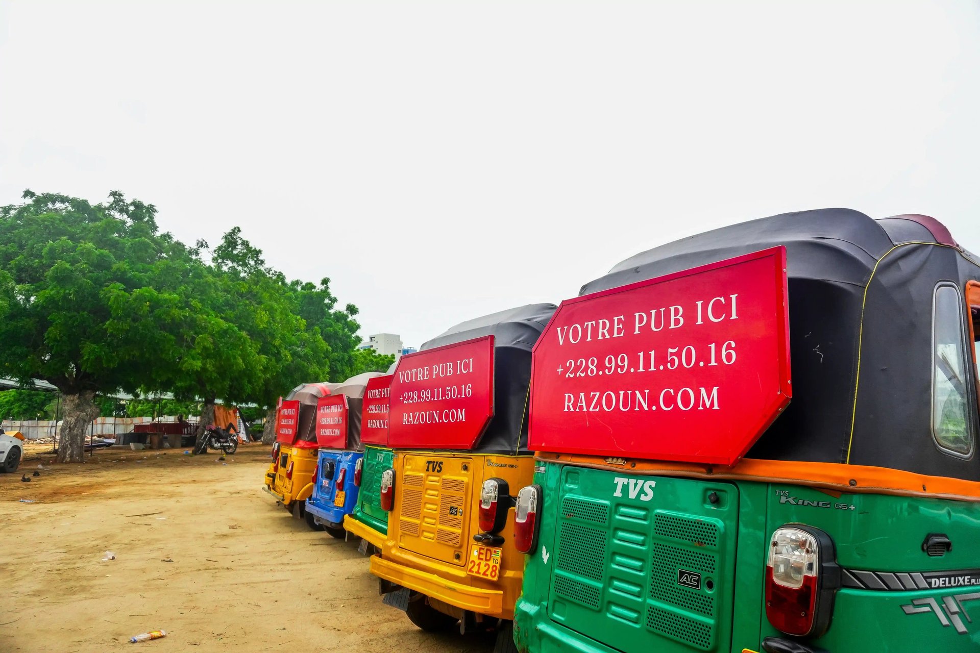 blue auto rickshaw on road