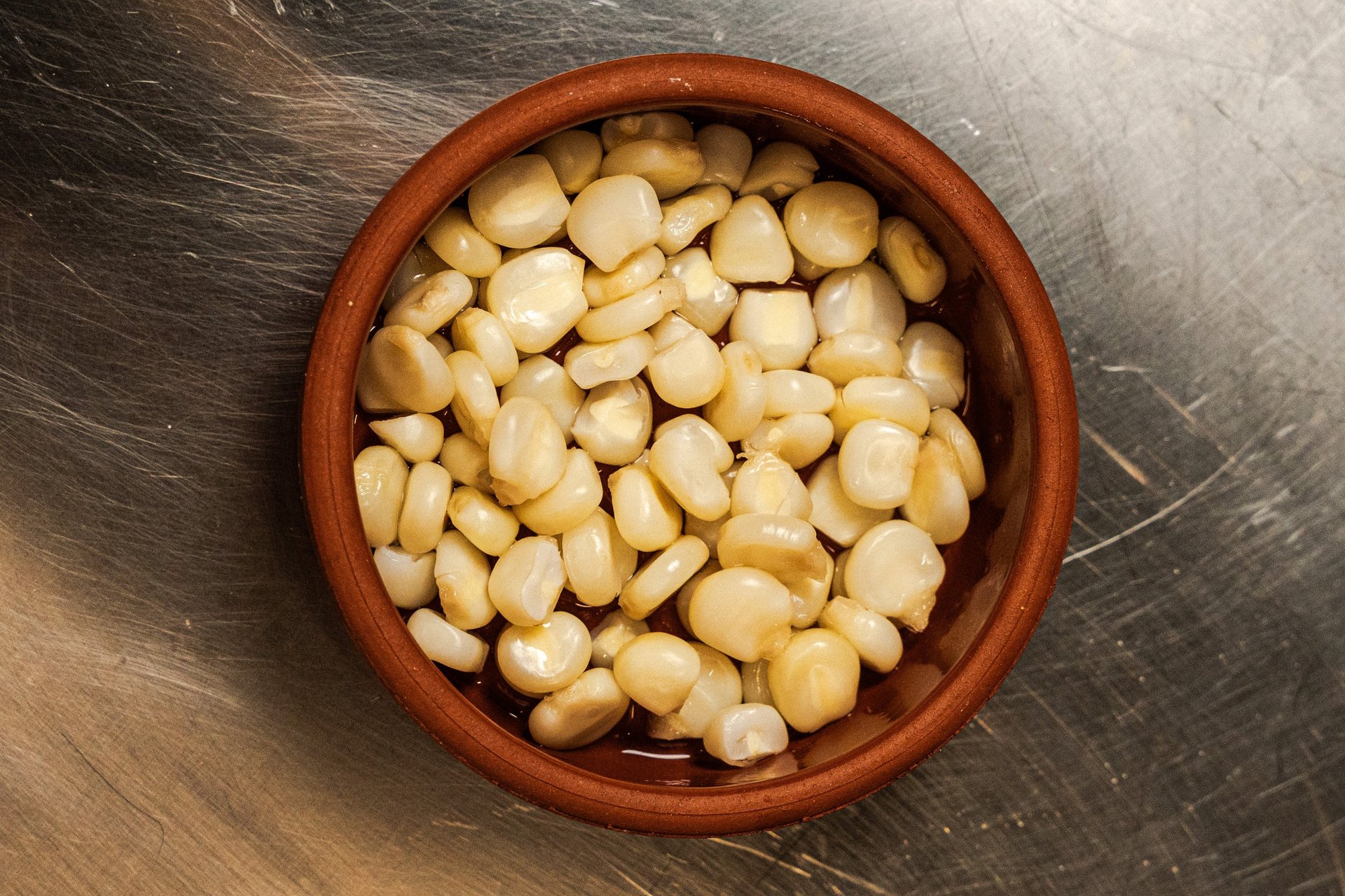woman wearing yellow long-sleeved dress under white clouds and blue sky during daytime