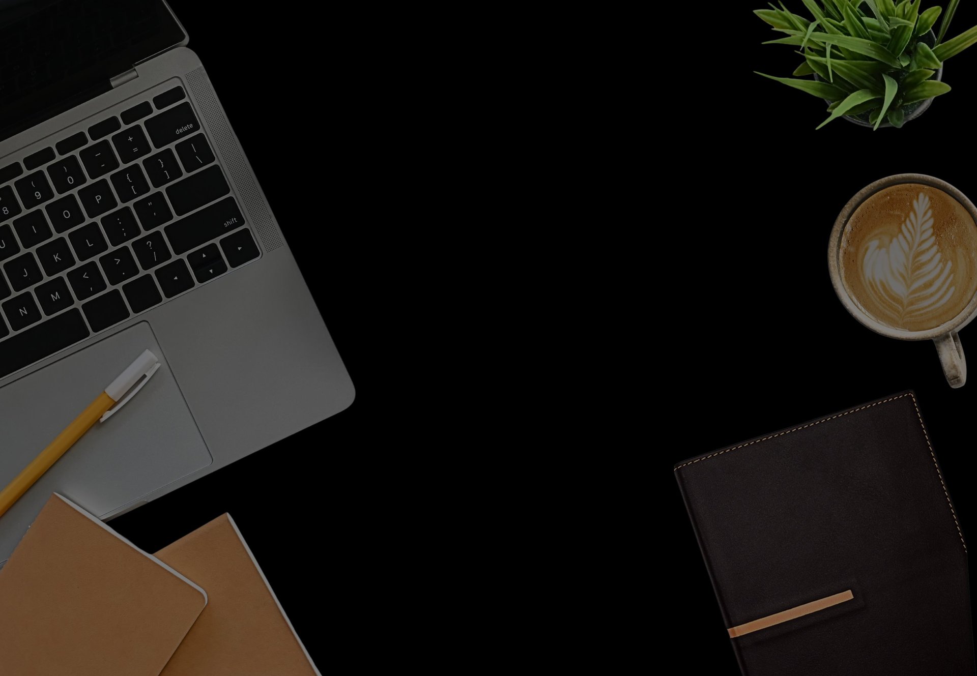 cup of coffee near MacBook Pro