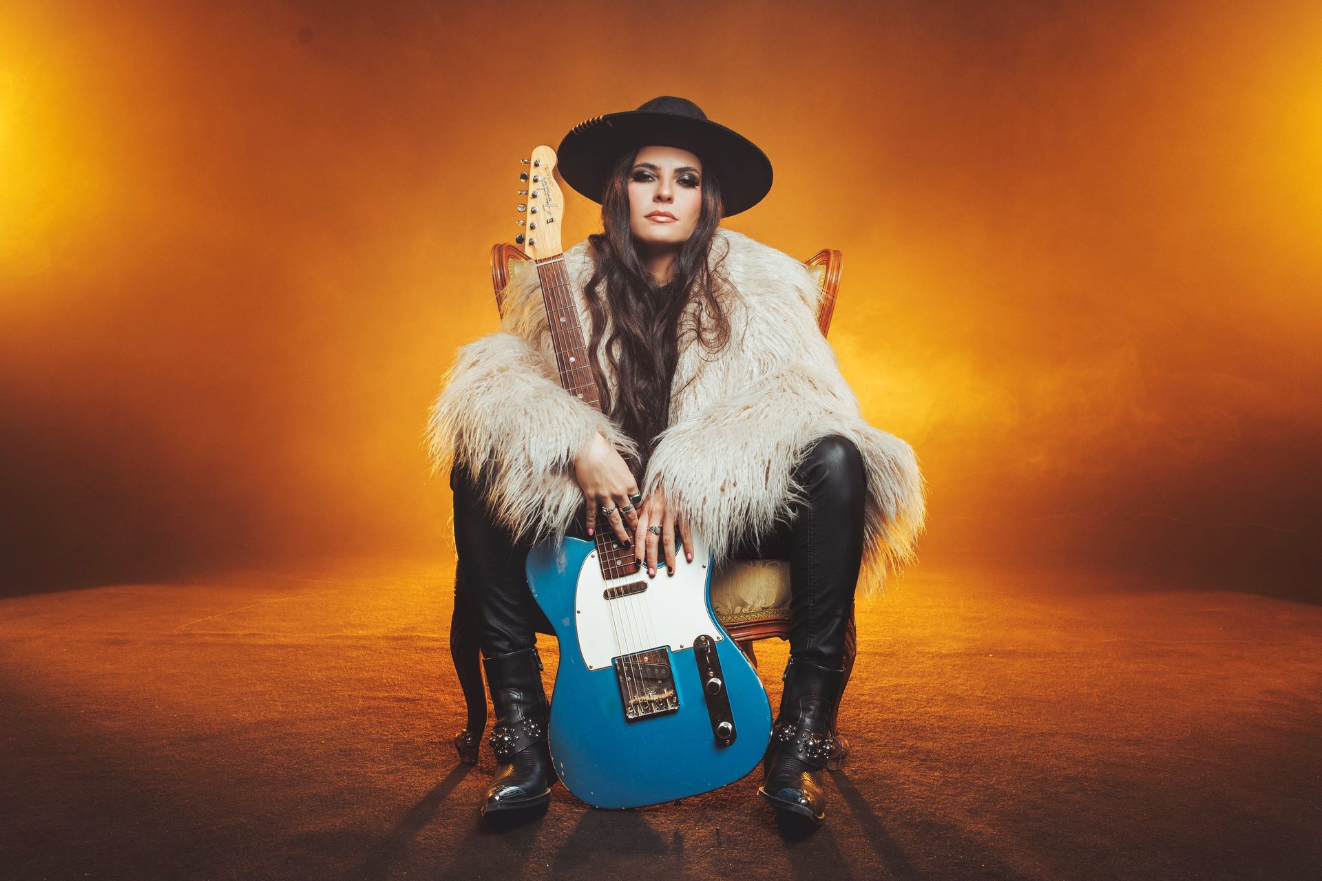 black and brown leather padded tub sofa