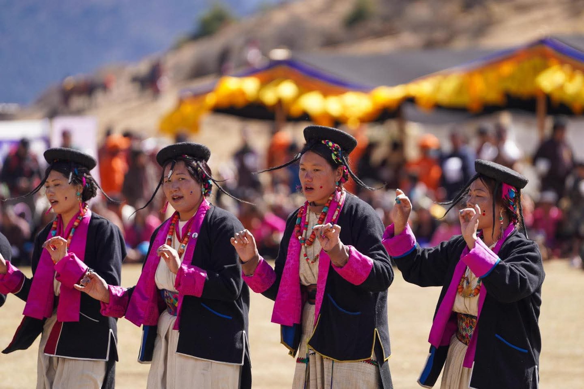 an abstract photo of a curved building with a blue sky in the background