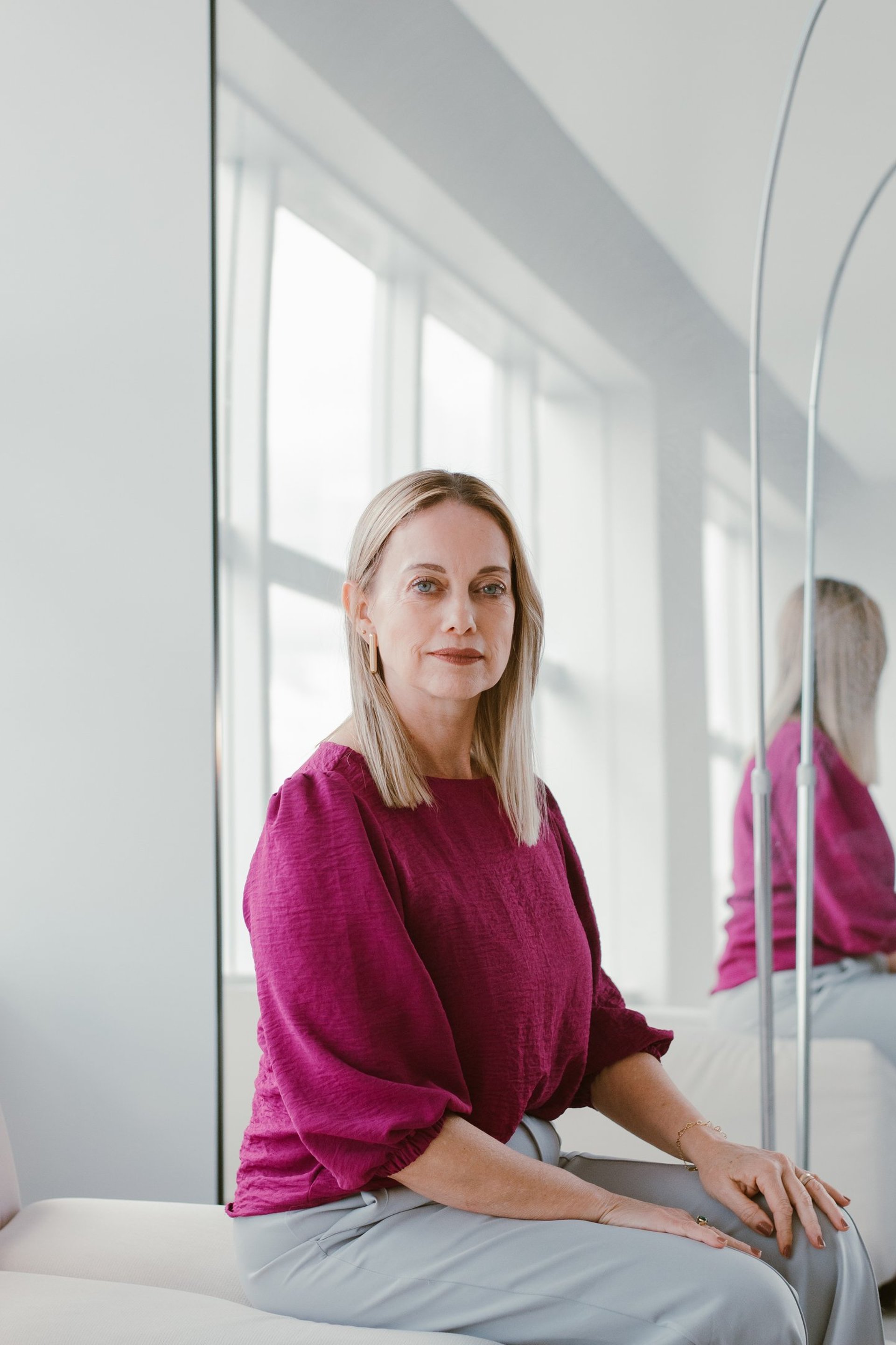 an abstract photo of a curved building with a blue sky in the background