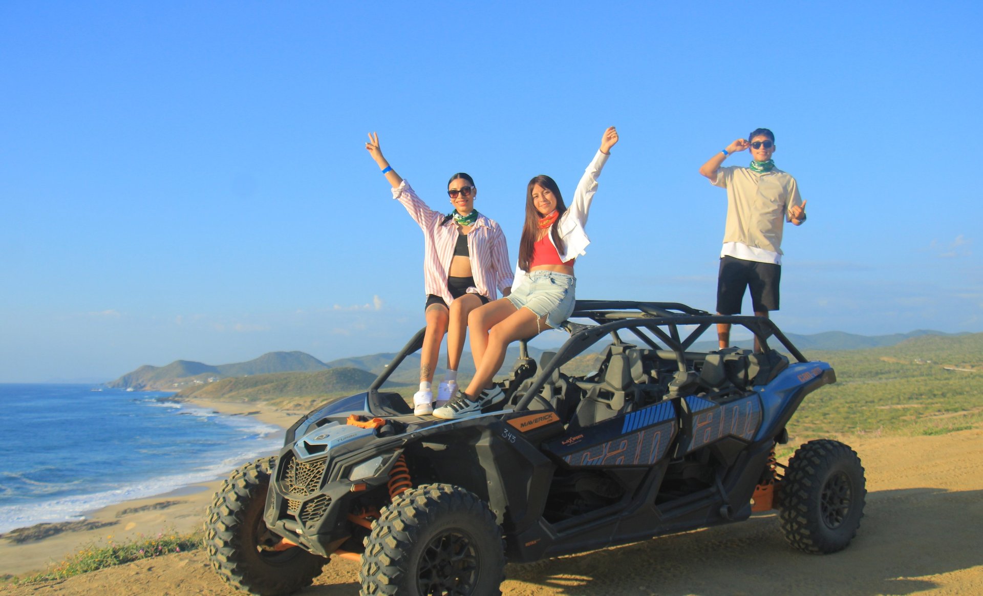 brown rock formation on sea shore under blue sky and white clouds during daytime