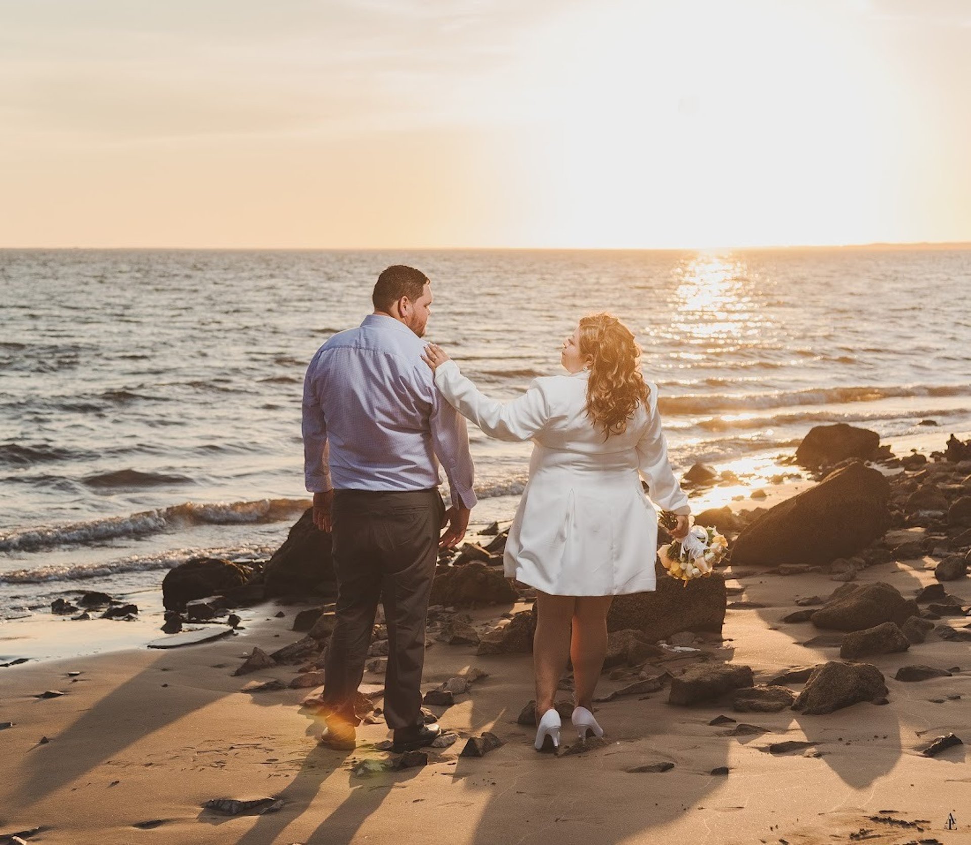 couple wearing silver-colored rings