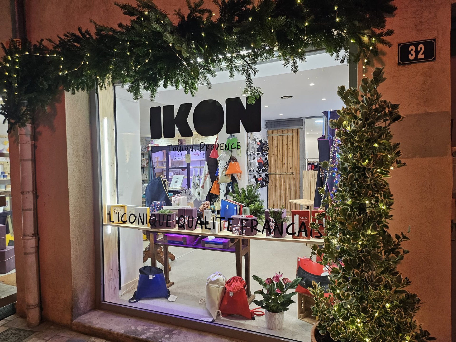 brown wooden table and chairs near glass window