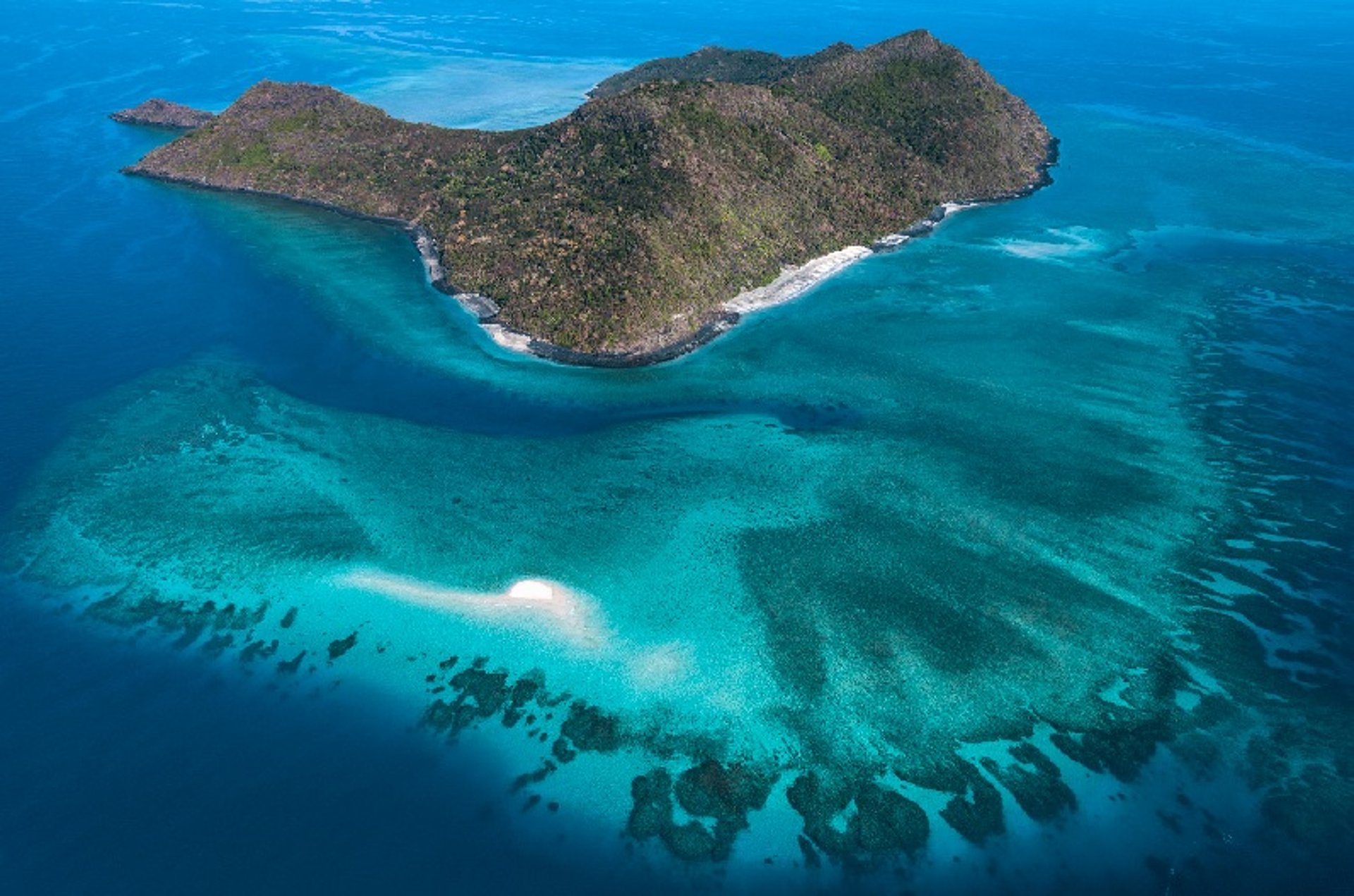 a small island in the middle of a large body of water