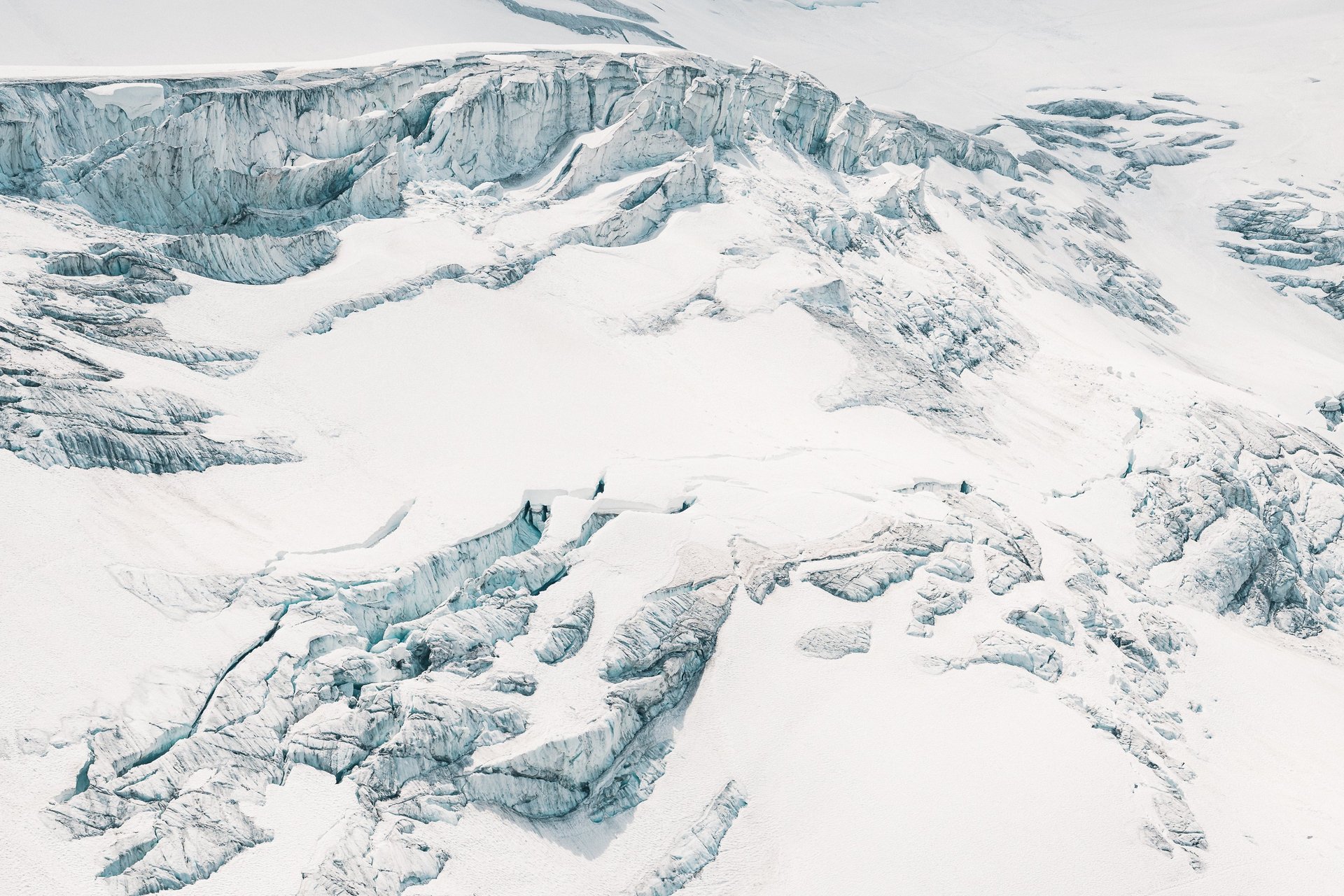 an abstract photo of a curved building with a blue sky in the background