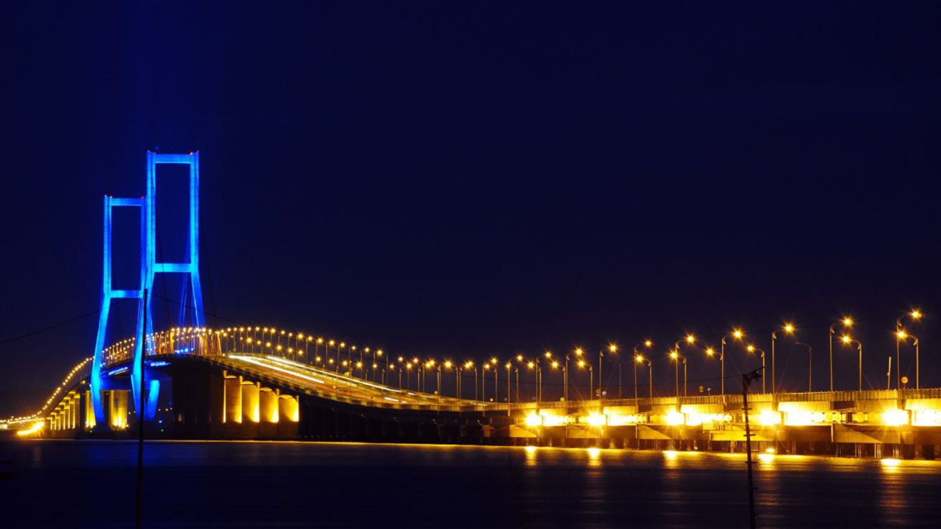 A woman works at a textile factory.