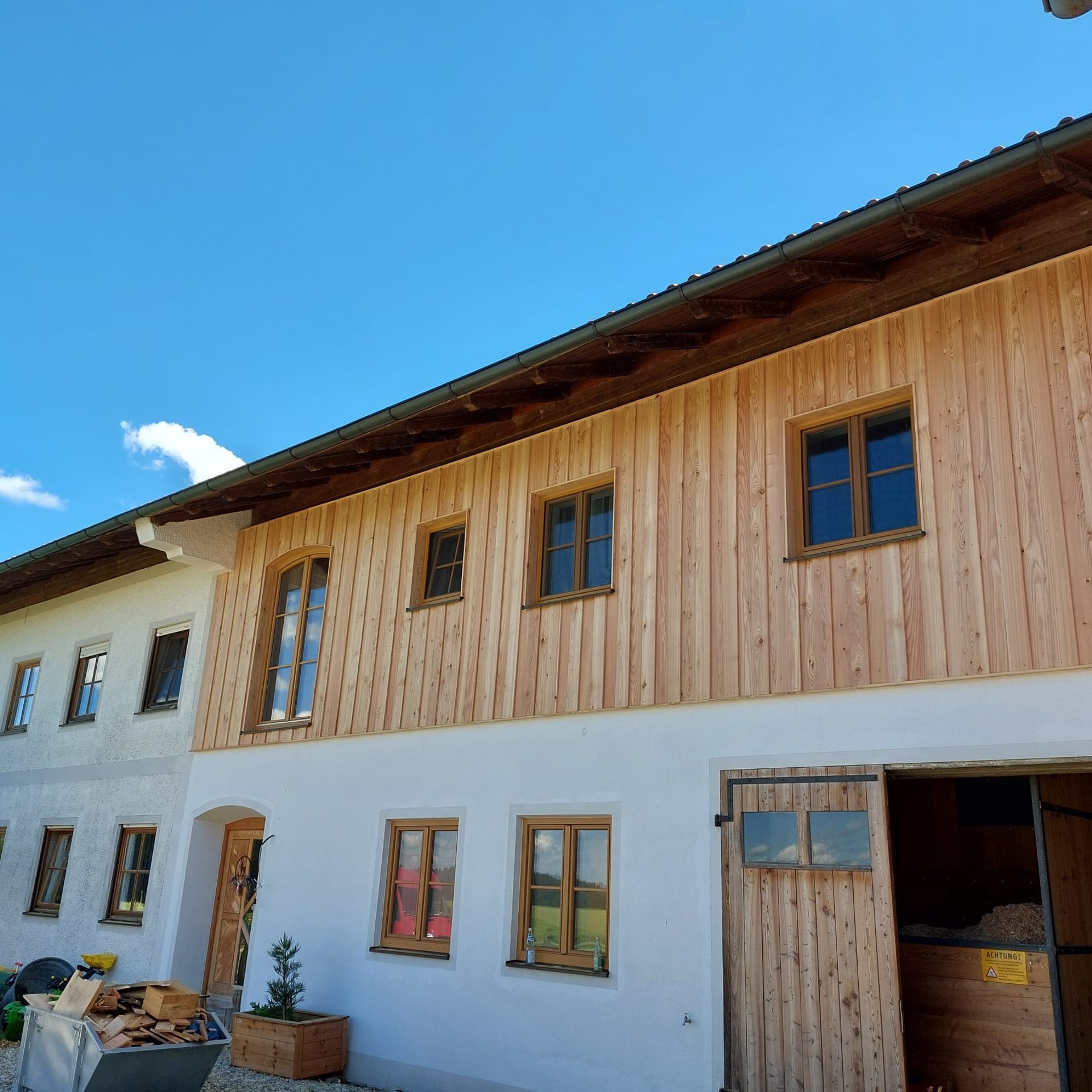 woman wearing yellow long-sleeved dress under white clouds and blue sky during daytime