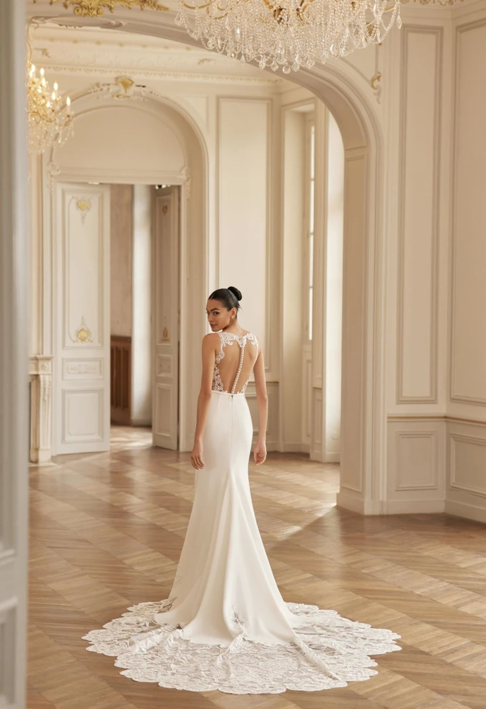 man in black suit standing beside woman in white wedding dress