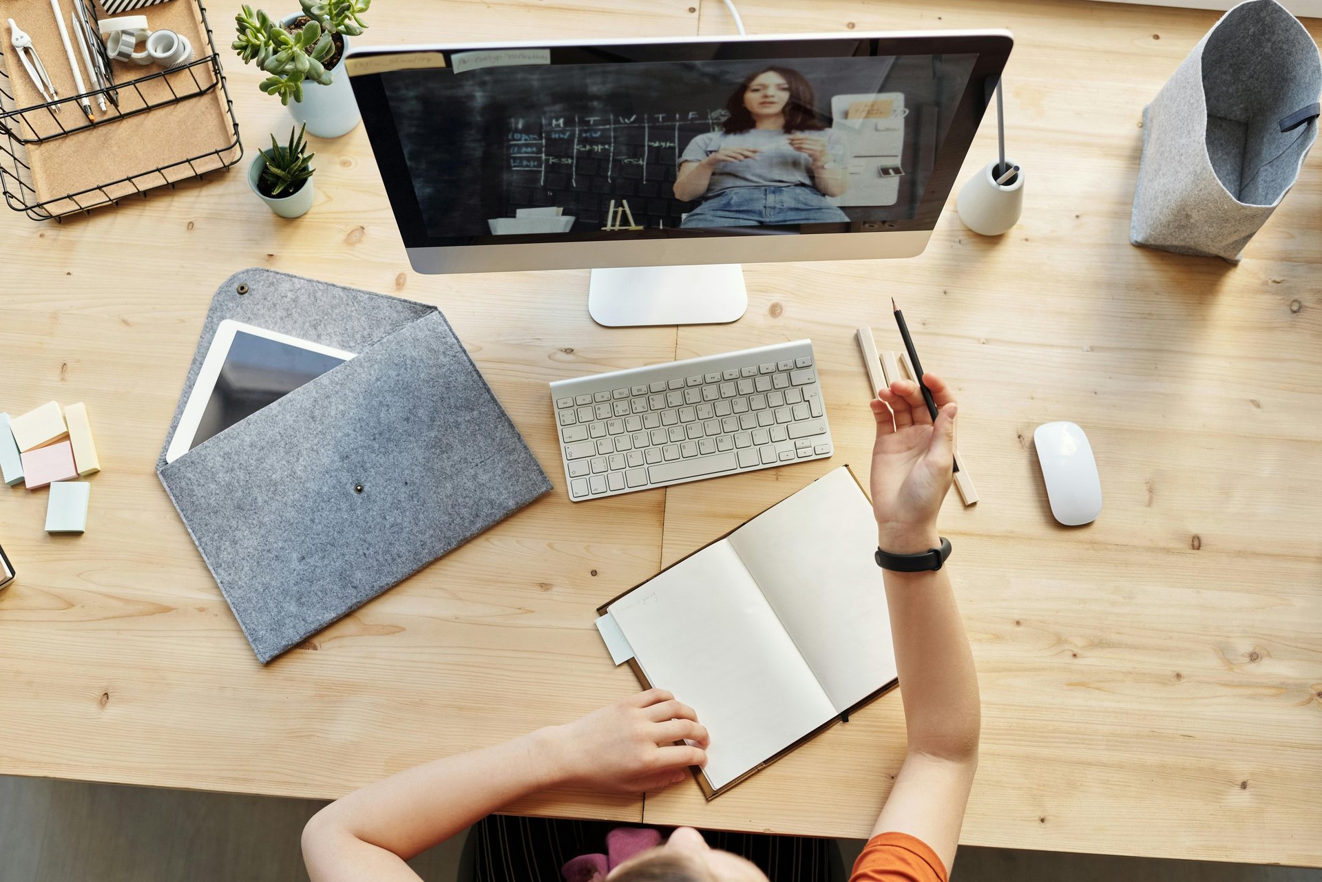 MacBook Pro near white open book