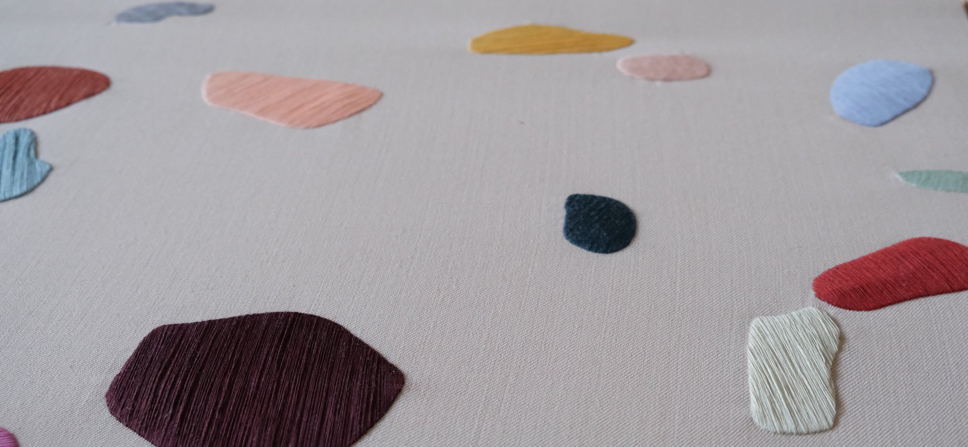 a close up of a black and brown abstract painting