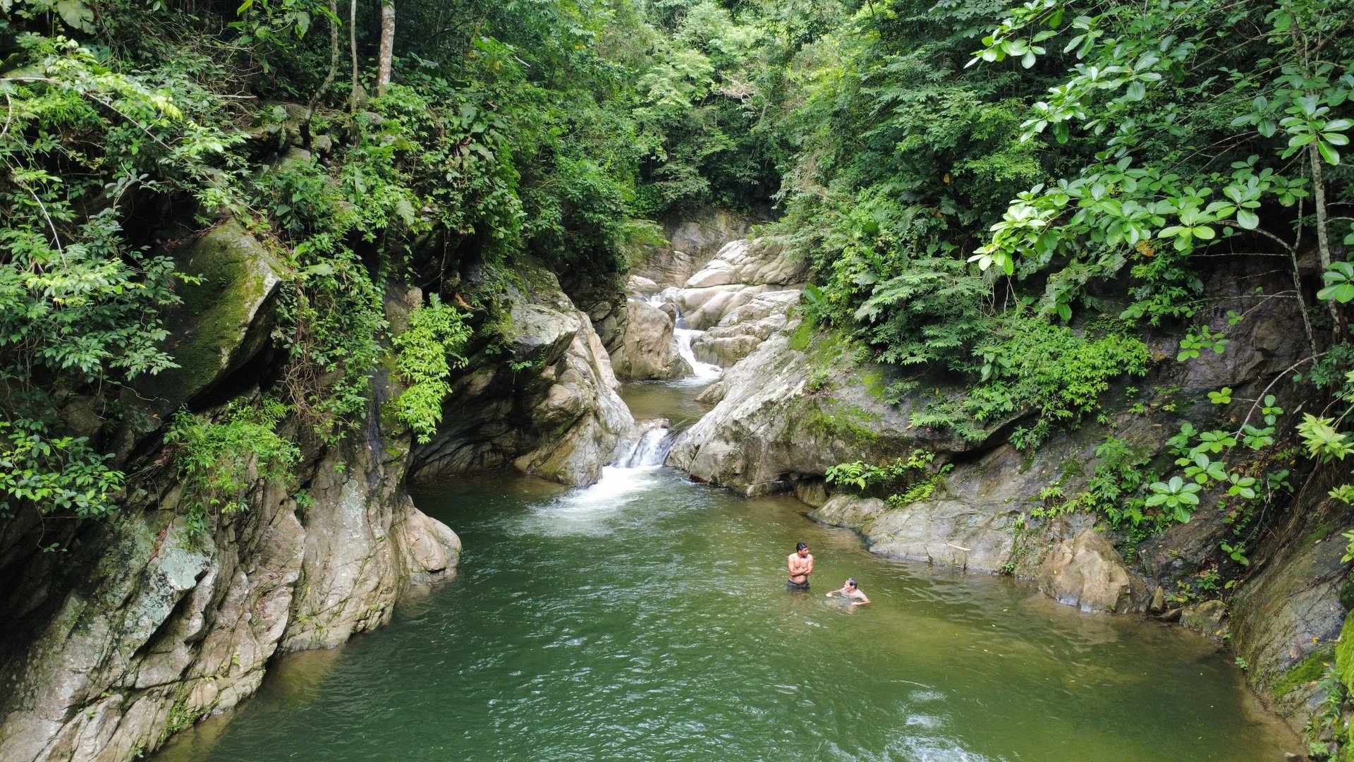 an abstract photo of a curved building with a blue sky in the background