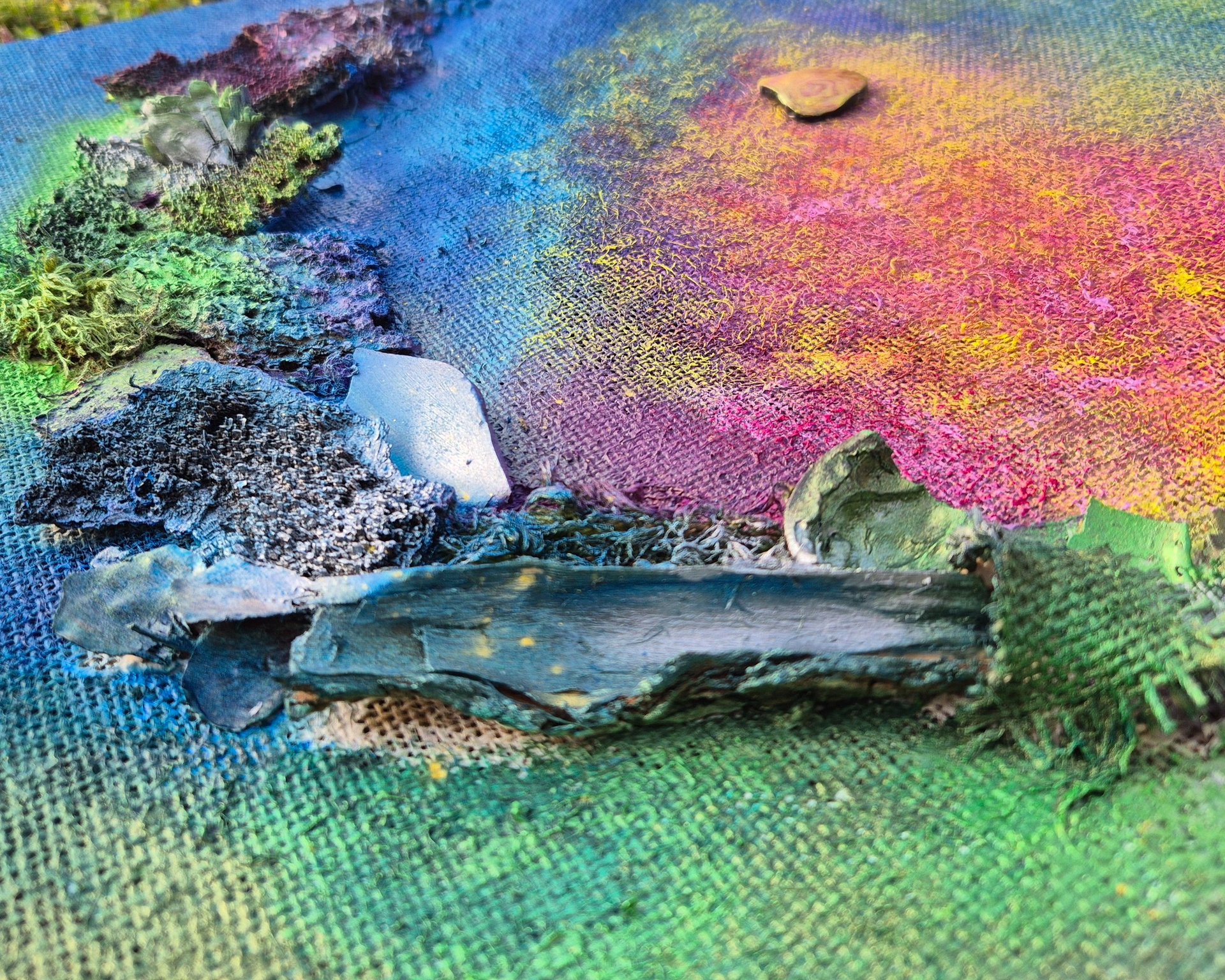 a can of beer sitting next to a pile of playing cards