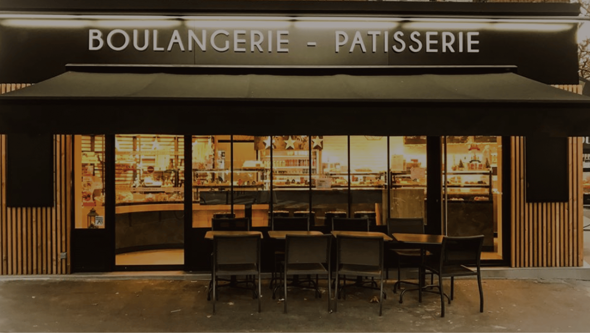 an abstract photo of a curved building with a blue sky in the background