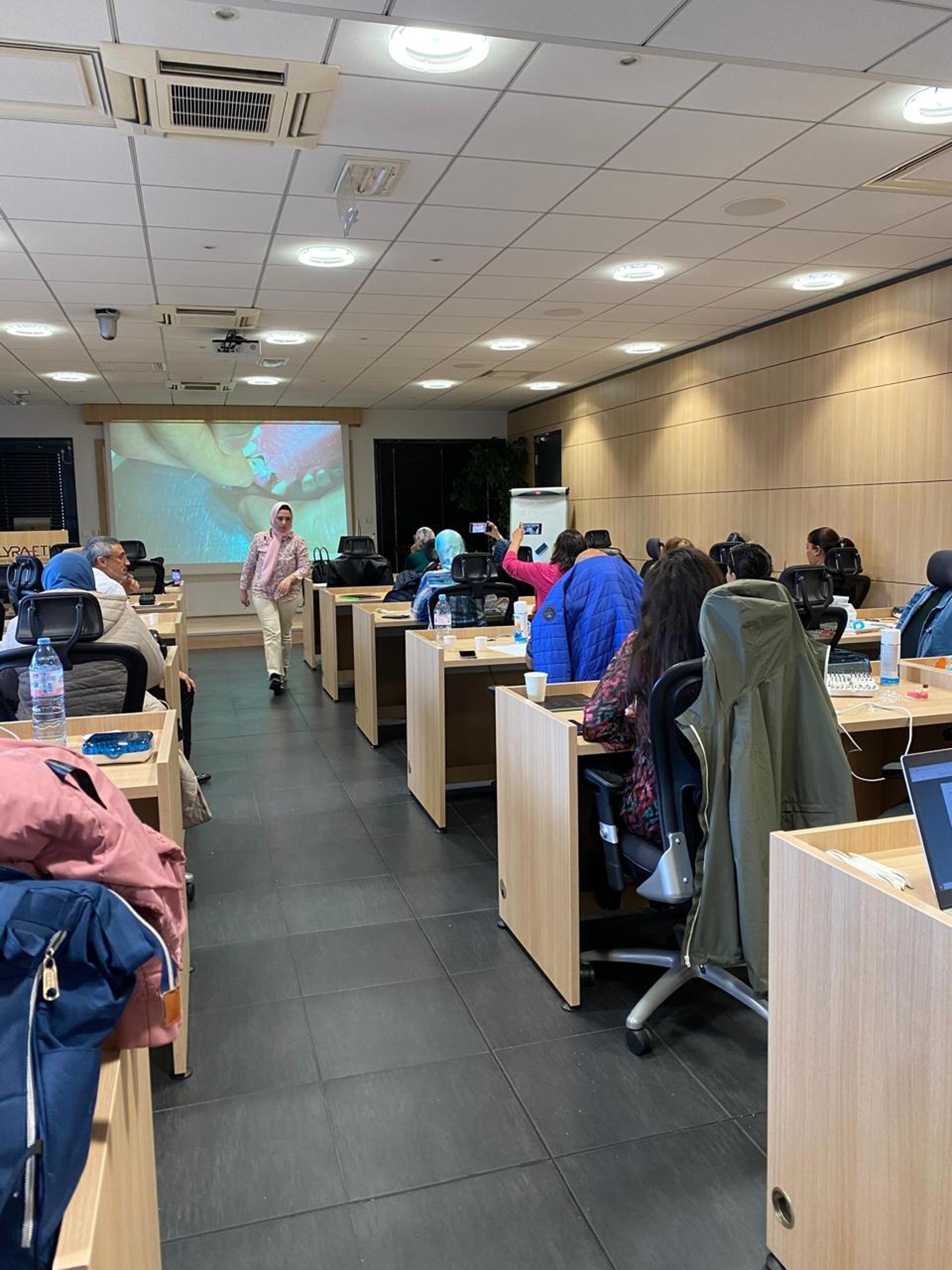 an abstract photo of a curved building with a blue sky in the background