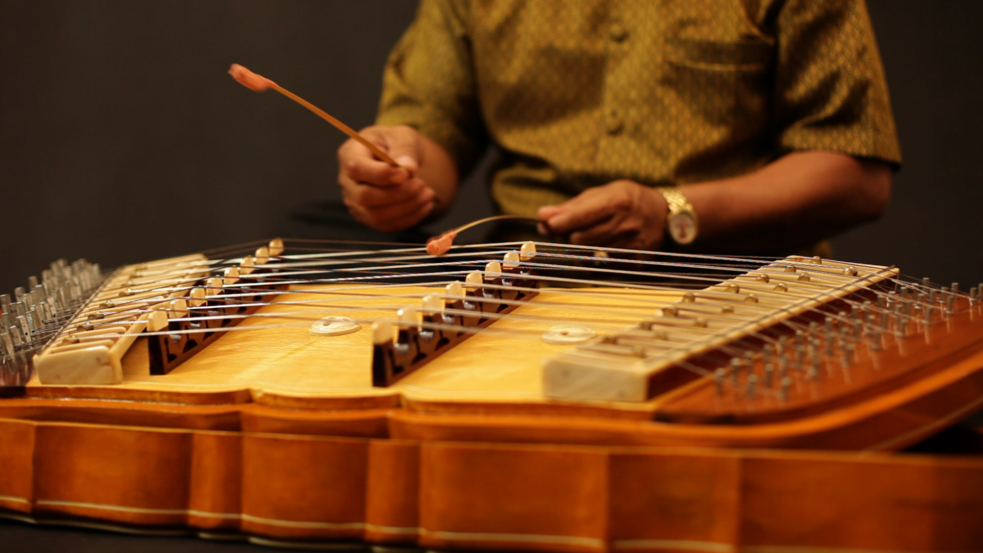 an abstract photo of a curved building with a blue sky in the background