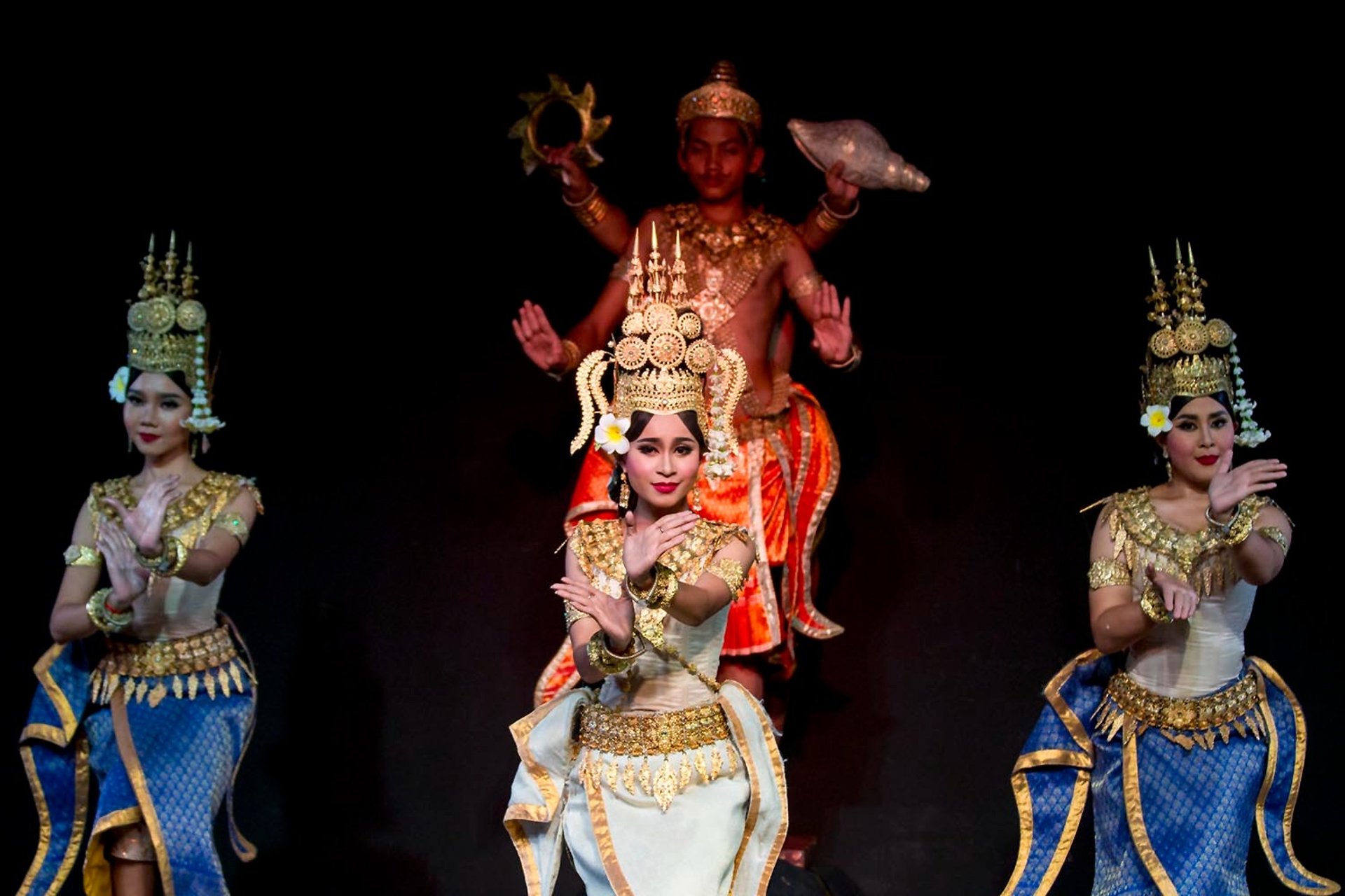 an abstract photo of a curved building with a blue sky in the background