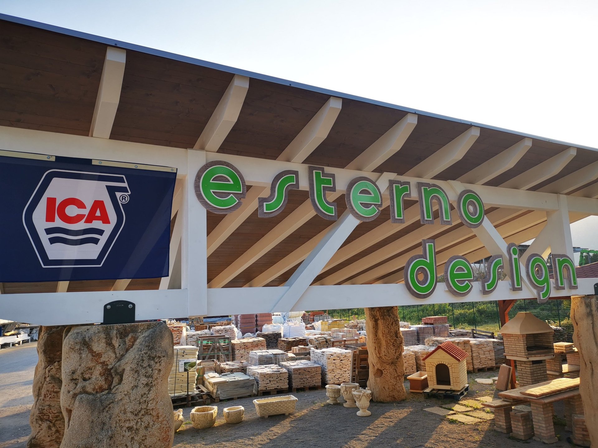 an abstract photo of a curved building with a blue sky in the background
