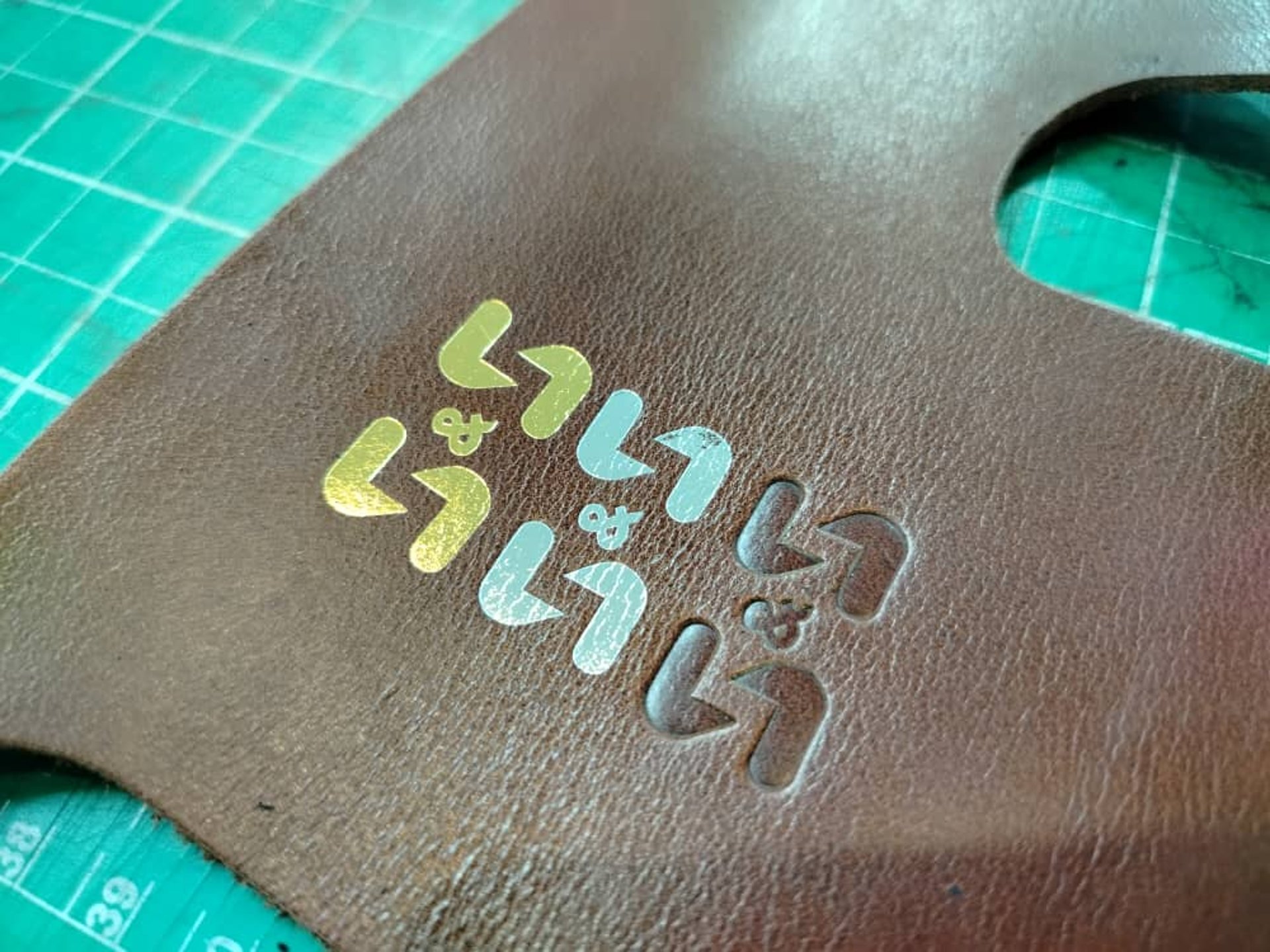 black and brown leather padded tub sofa