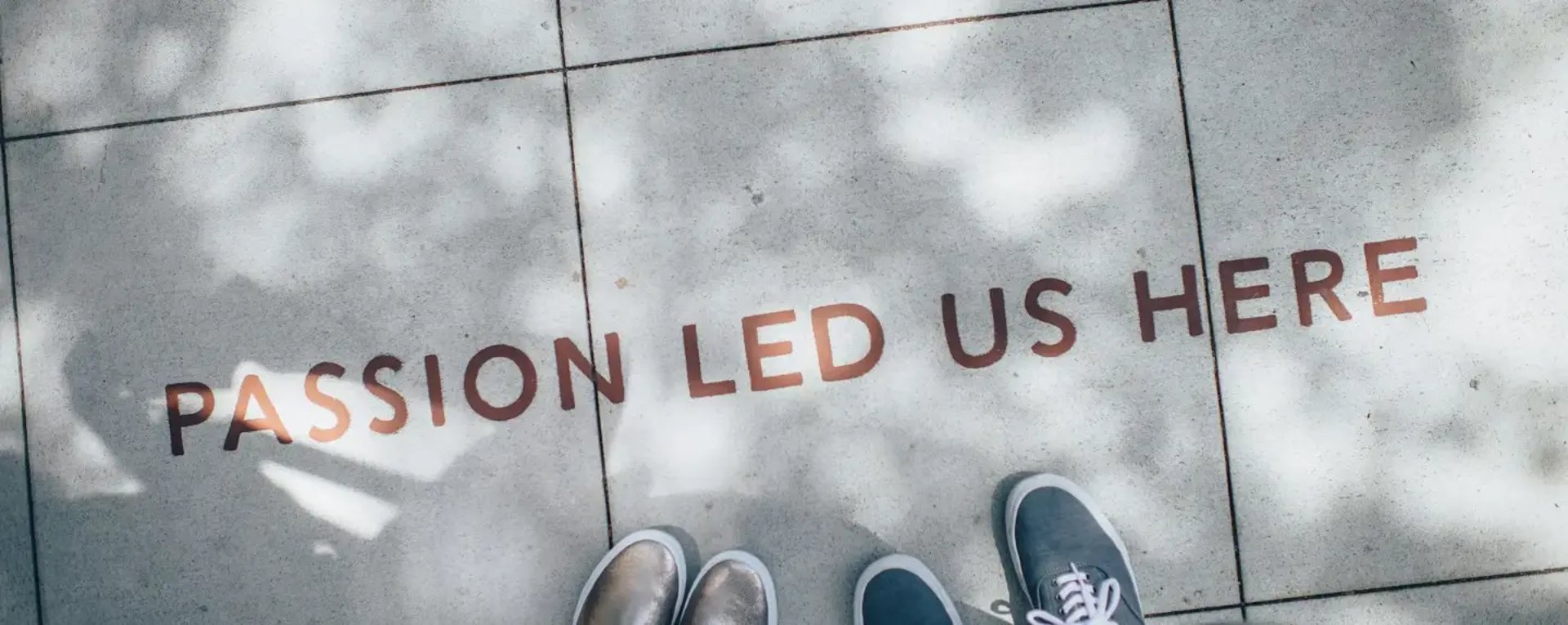 two person standing on gray tile paving