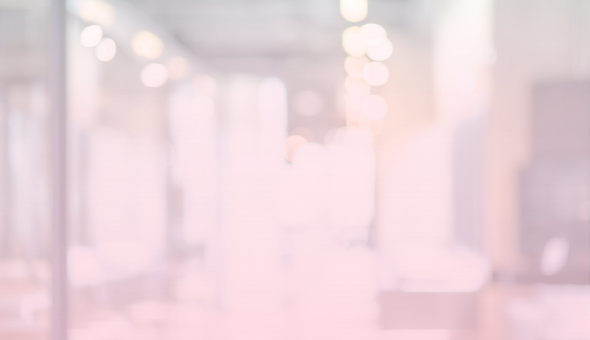 two white wooden tables near glass window