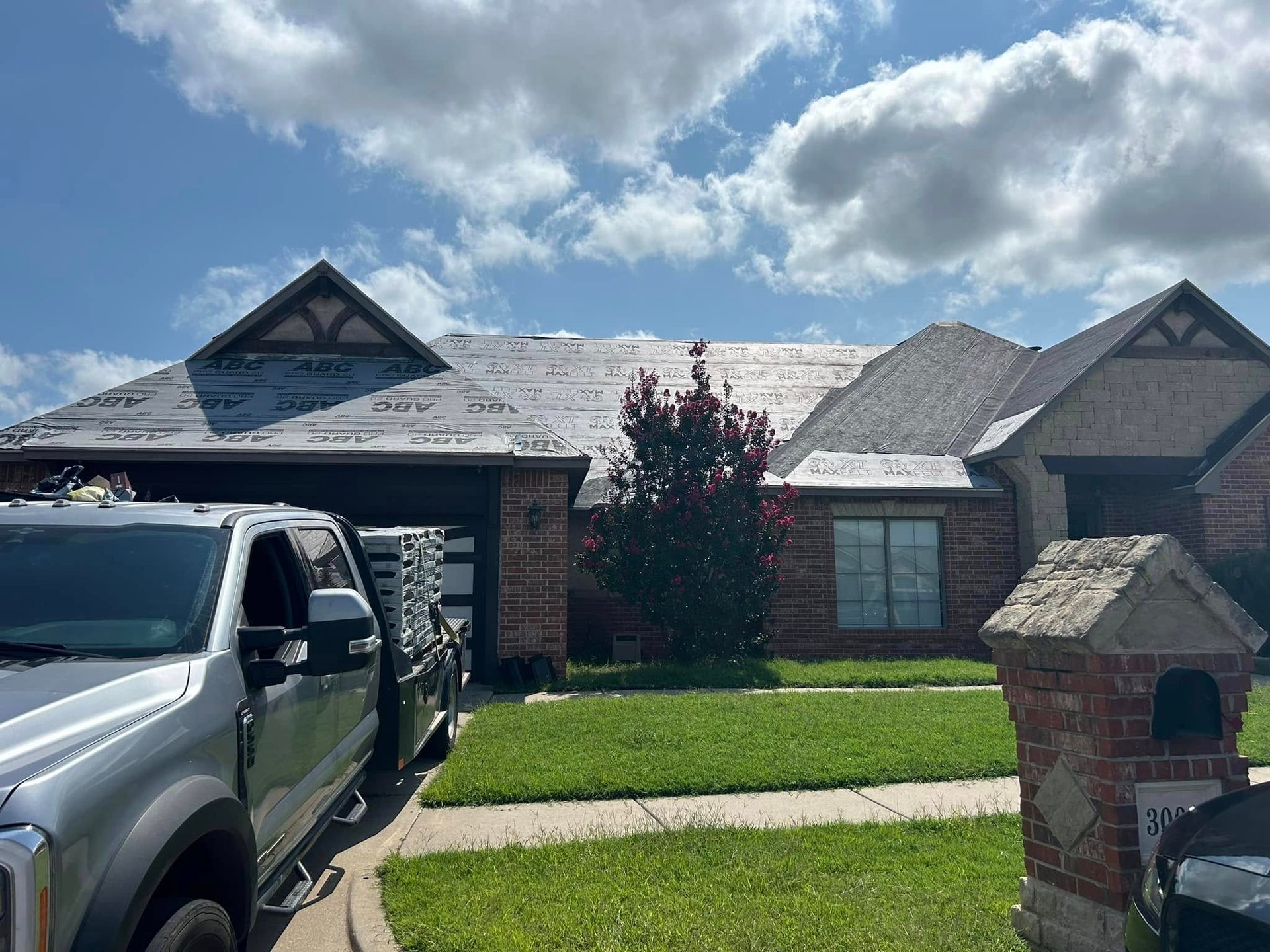 woman wearing yellow long-sleeved dress under white clouds and blue sky during daytime