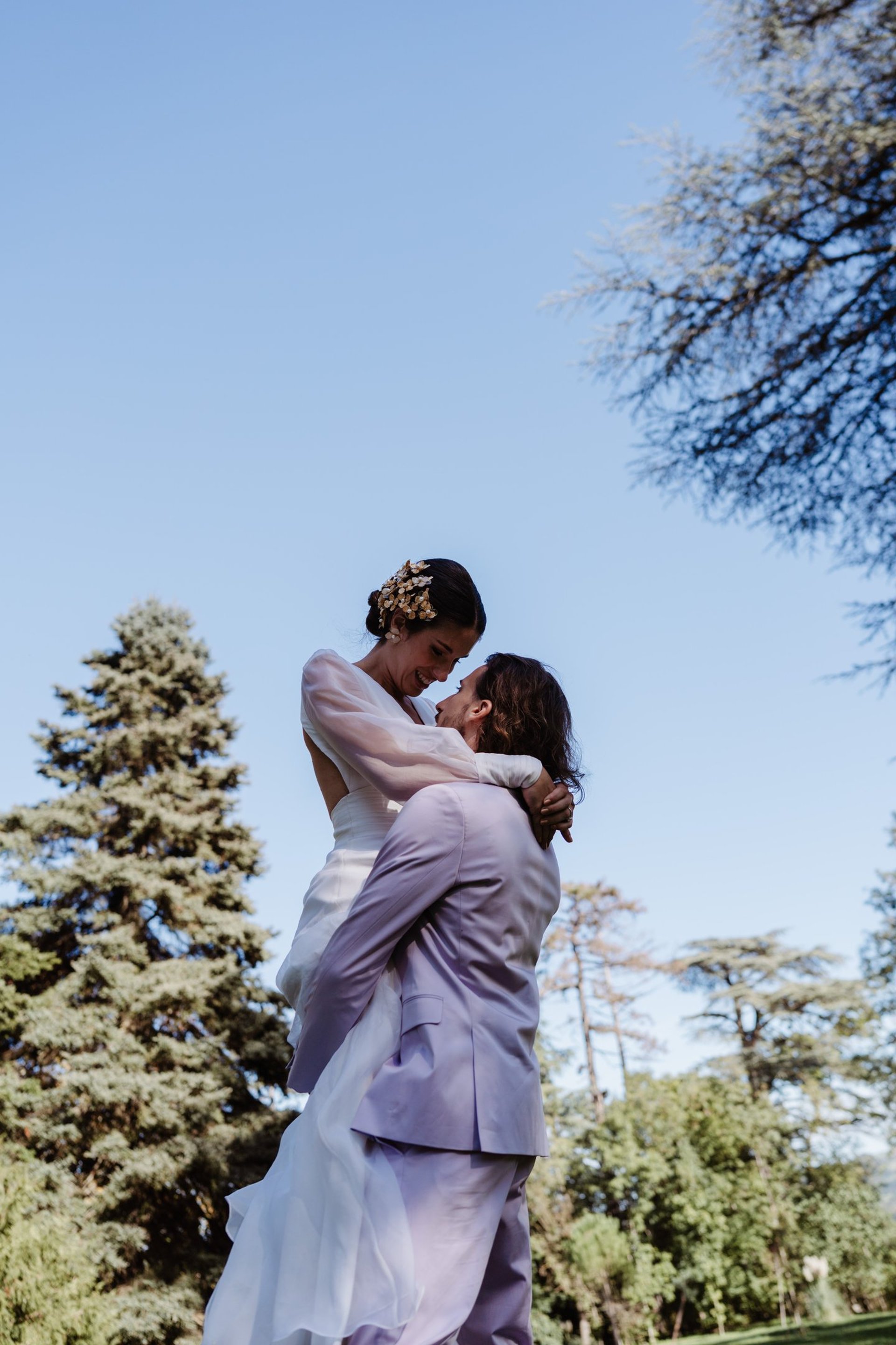an abstract photo of a curved building with a blue sky in the background