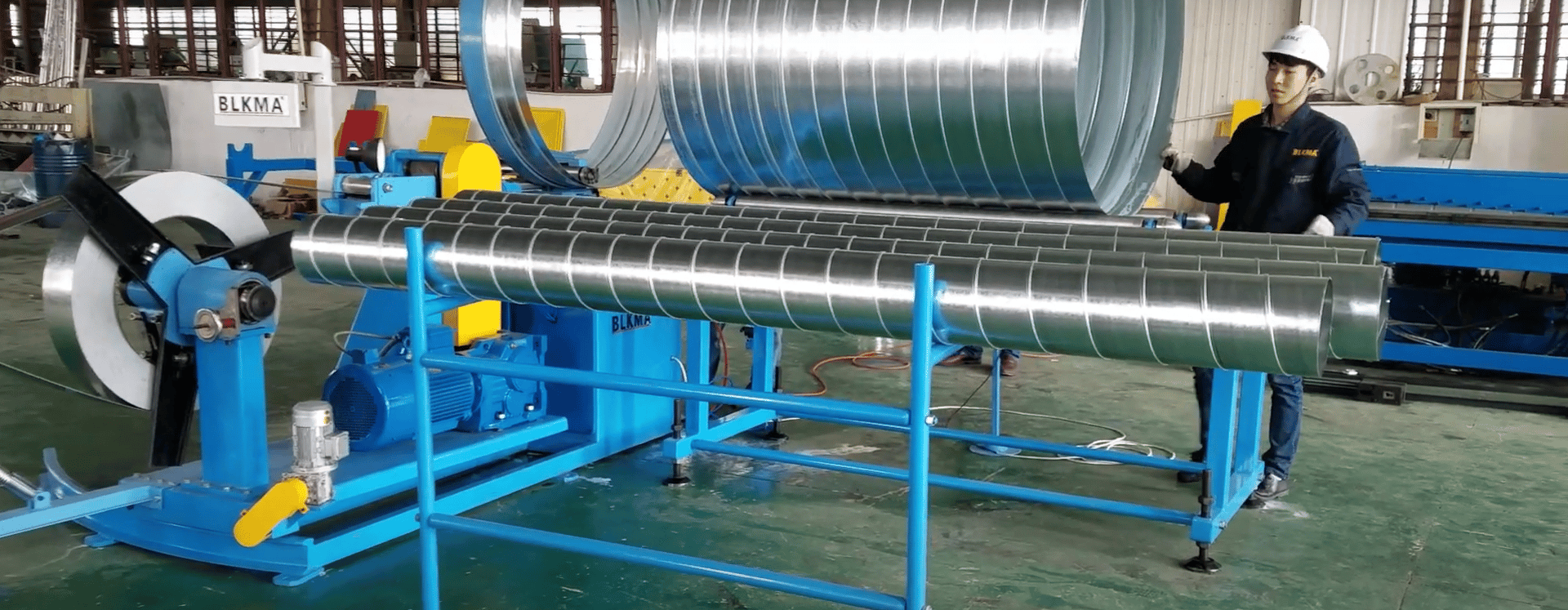 an abstract photo of a curved building with a blue sky in the background