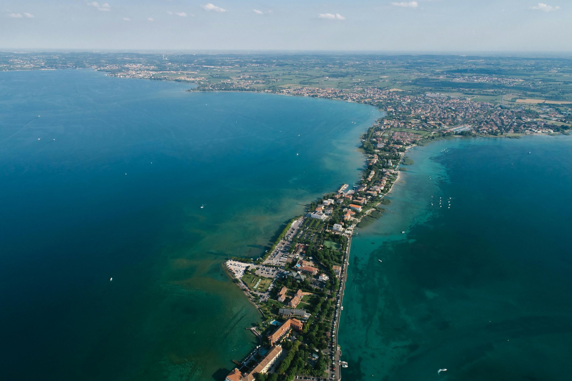 an abstract photo of a curved building with a blue sky in the background