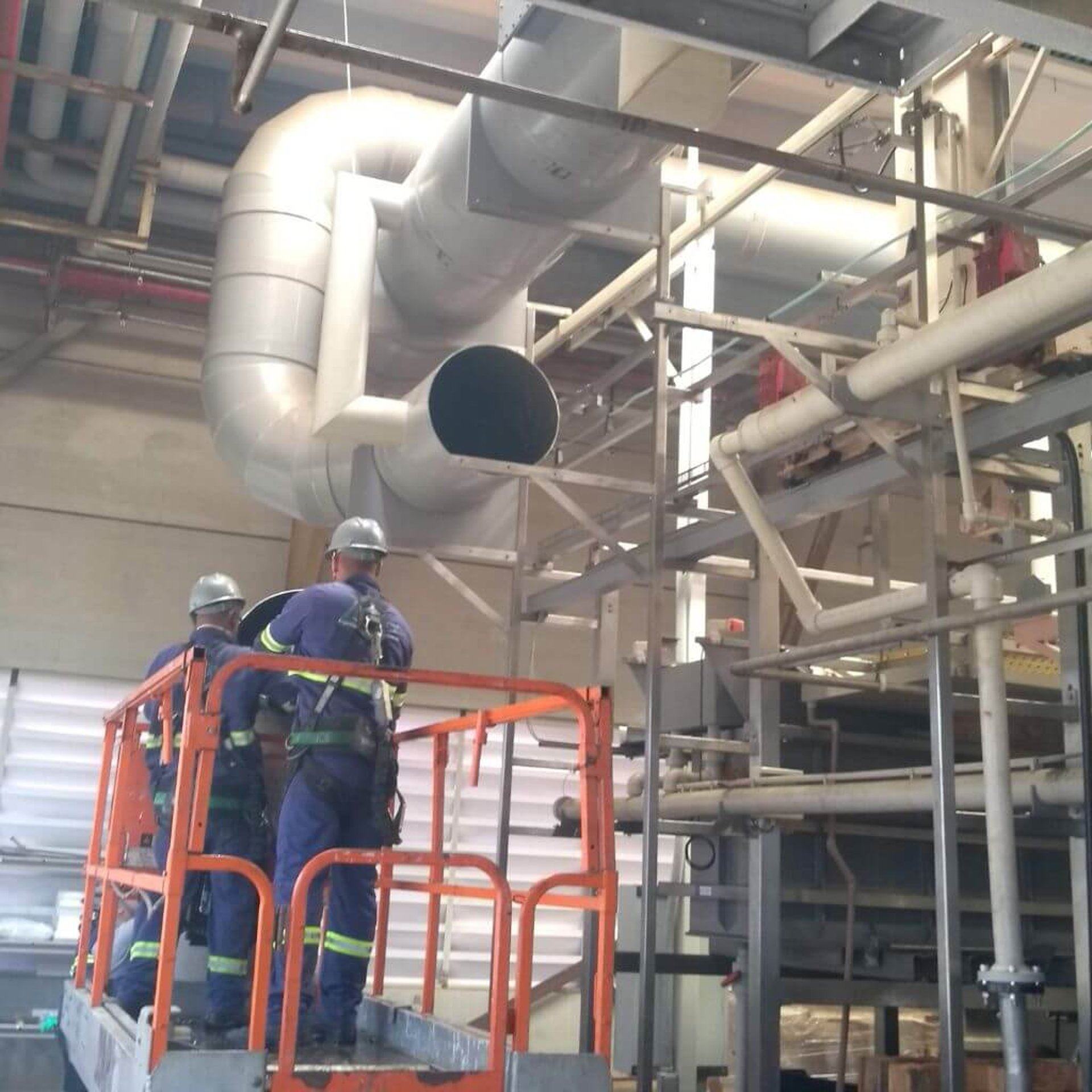 woman wearing yellow long-sleeved dress under white clouds and blue sky during daytime