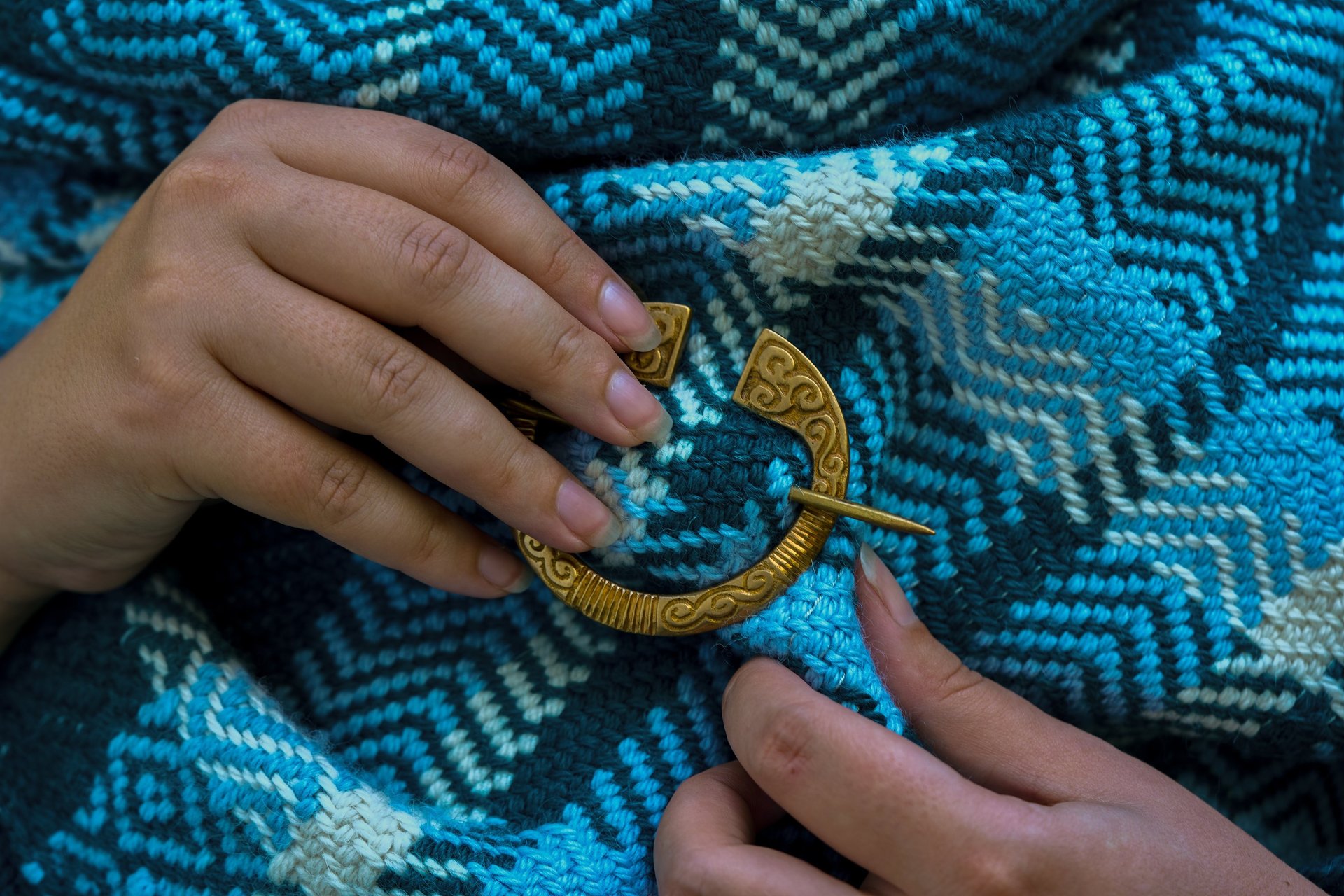 an abstract photo of a curved building with a blue sky in the background