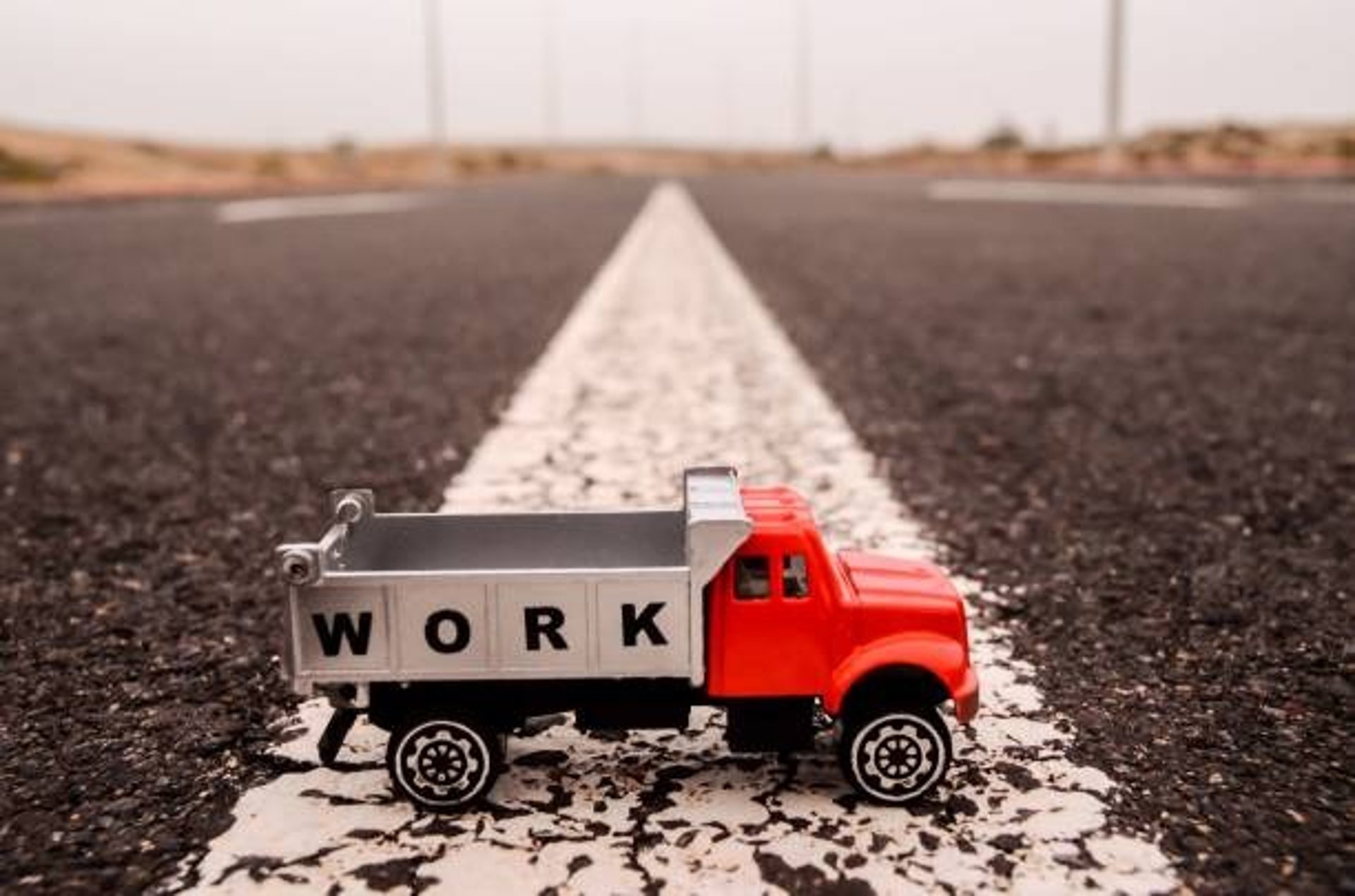 woman wearing yellow long-sleeved dress under white clouds and blue sky during daytime